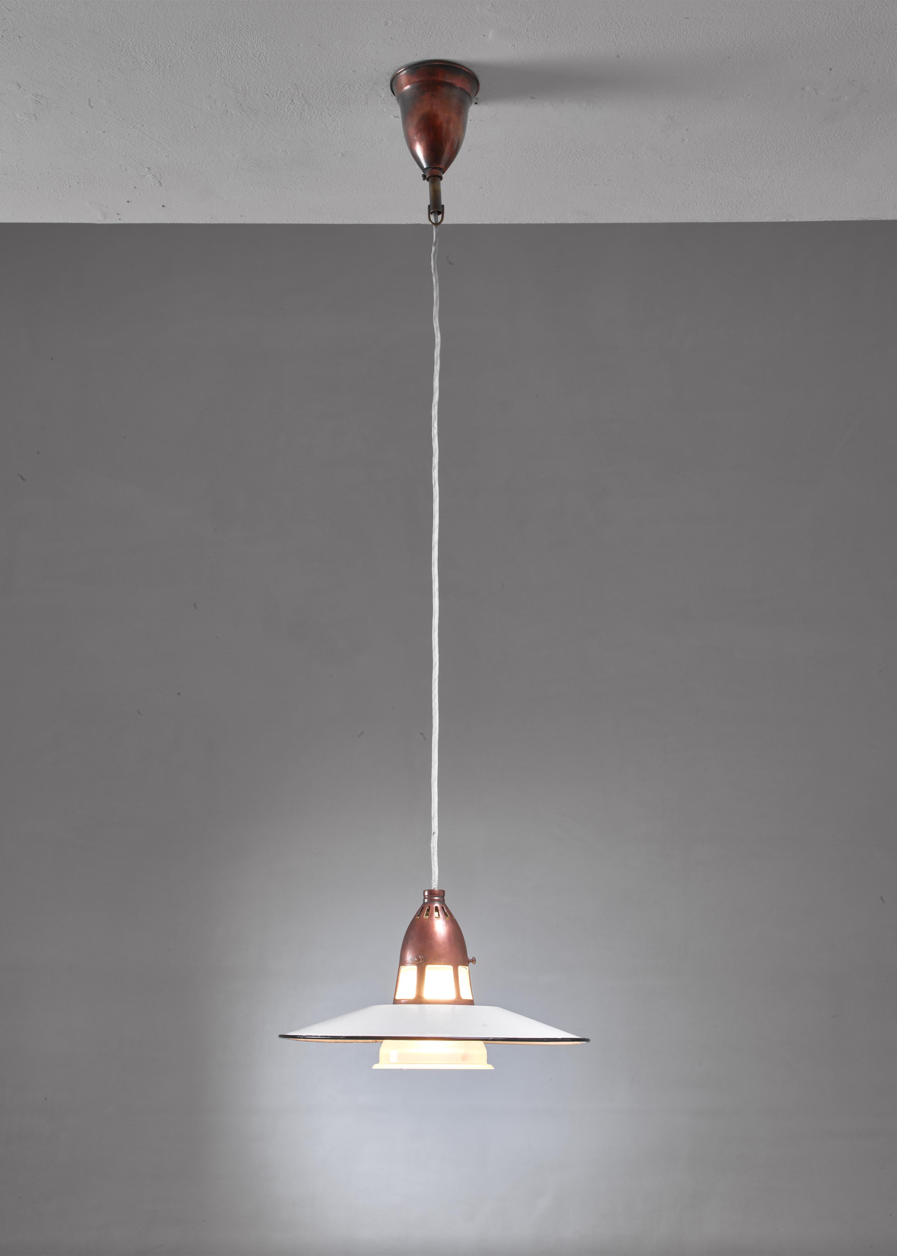 A Danish copper and glass pendant by Lyfa.

The lamp has a white enameled metal shade and a frosted glass diffuser in a copper frame.
 