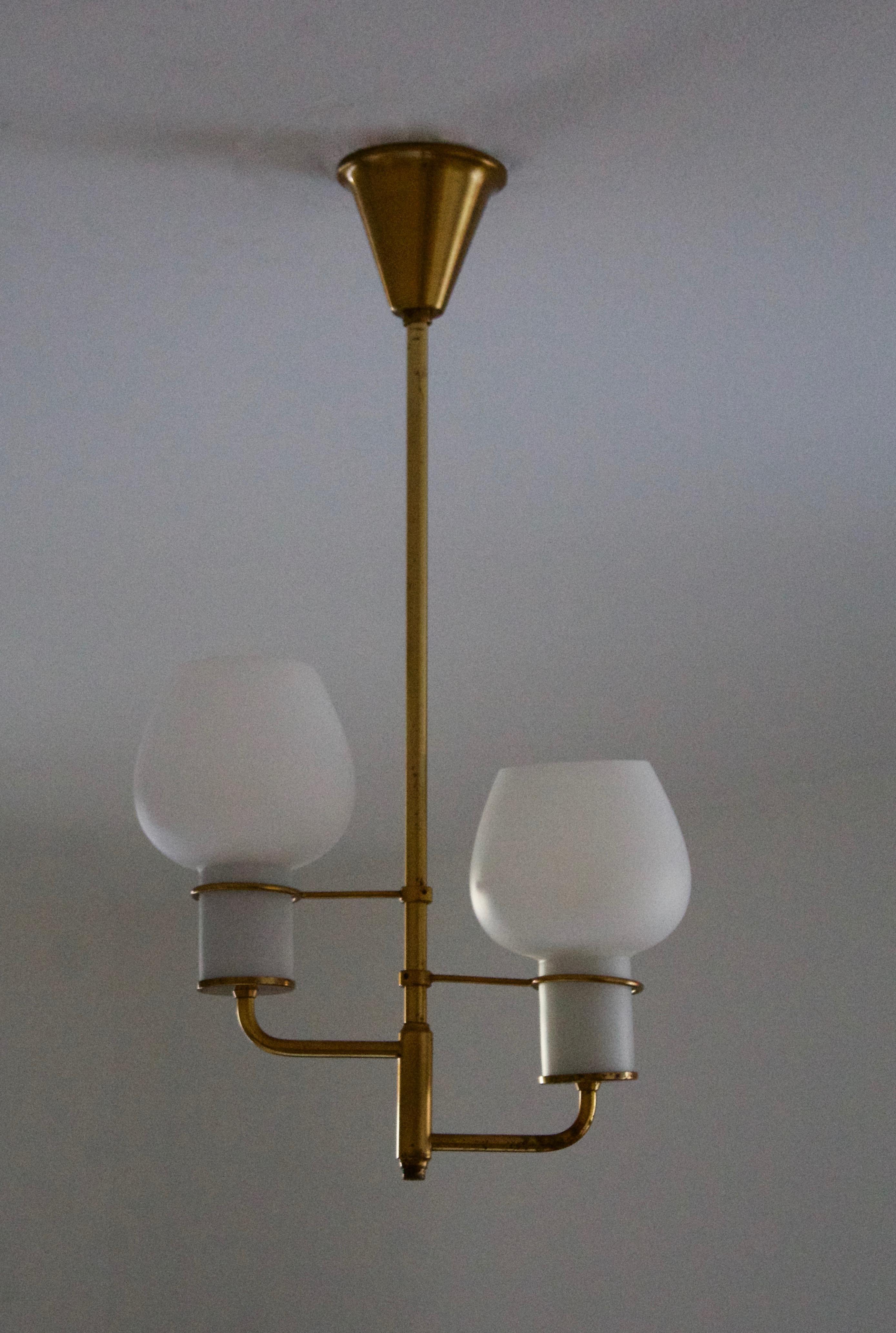 A pendant light / chandelier. Production attributed to Lyfa, Denmark, 1940s-1950s.

Other designers of the period include Paavo Tynell, Jean Royère, Josef Frank, Kaare Klint, and Alvar Aalto.