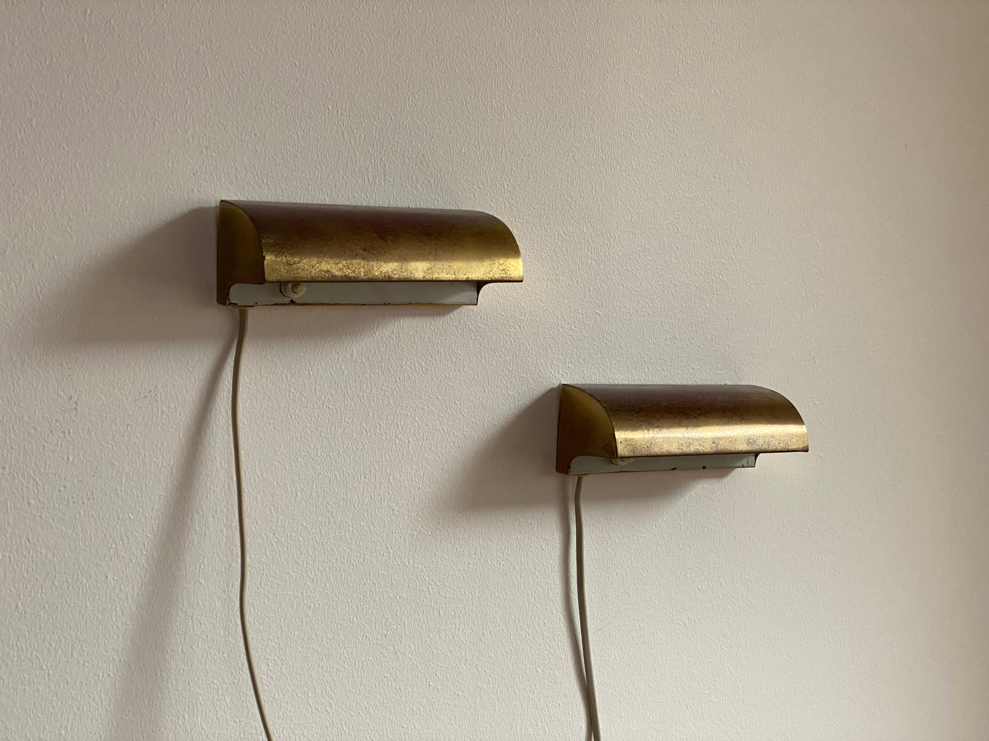 A pair of functionalist / minimalist wall lights / sconces. Designed and produced in Denmark, 1950s. Lacquered inside. 

Other designers of the period include Le Corbusier, Charlotte Perriand, Paavo Tynell, Kaare Klint, and Hans-Agne Jakobsson.