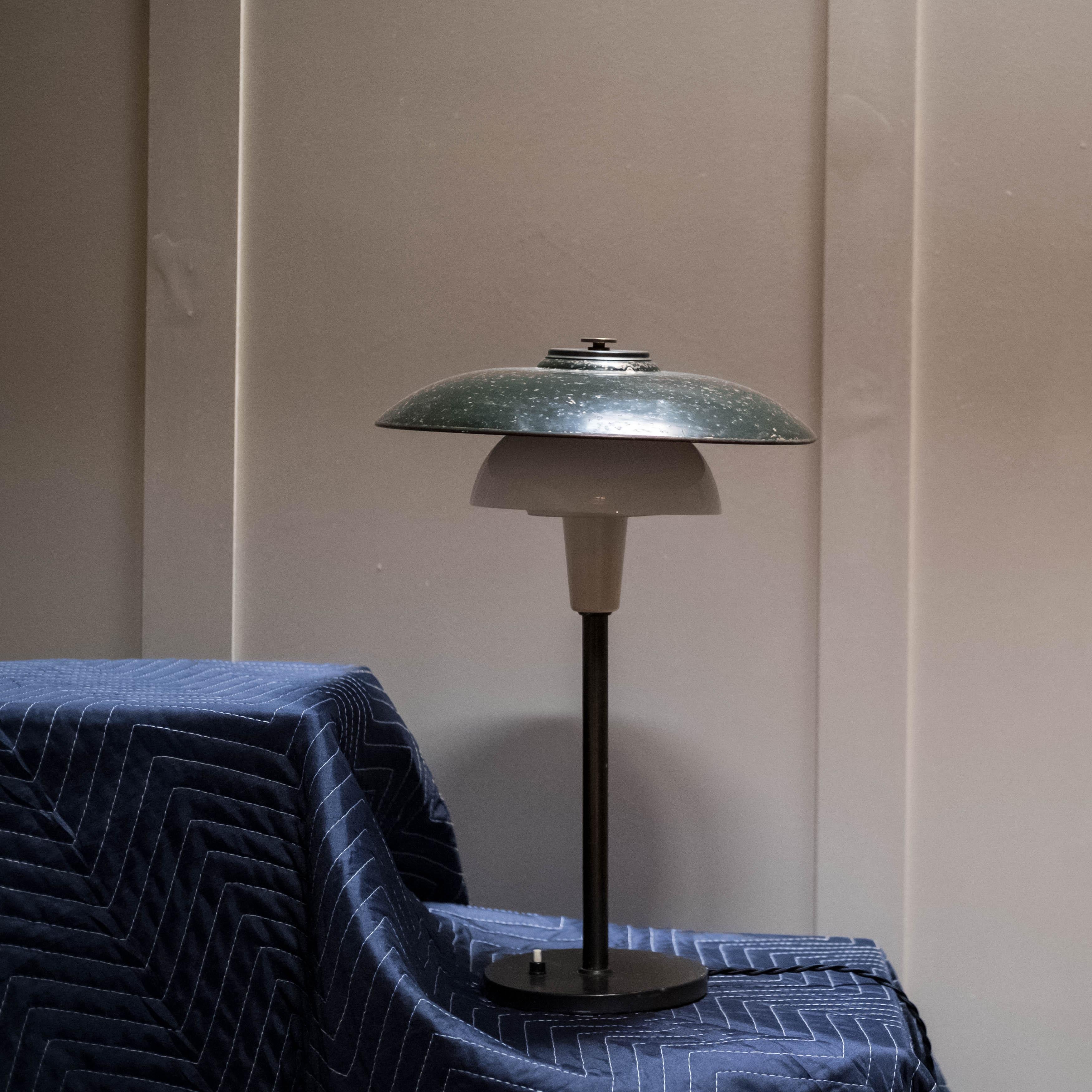 Table lamp manufactured by Lyfa, Denmark in the 1930's with natural patina. Good vintage condition. Outer shade and base plate with moderate oxidation and subsequent finish loss, consistent with age and use. Opaline glass elements in excellent