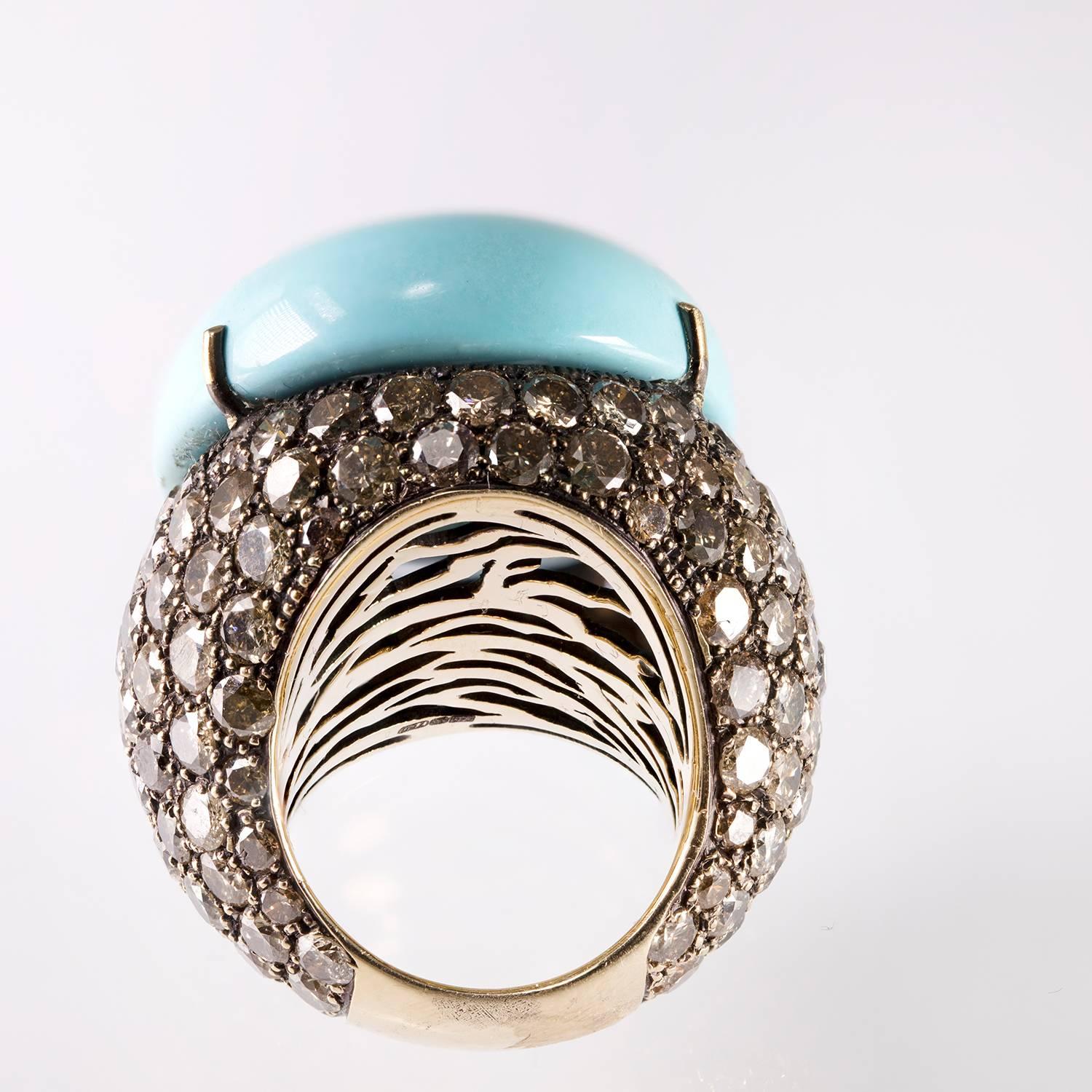 Impressive, One of a Kind, 18kt Champagne Color Gold Dome Ring by Lygia Demades featuring a Natural Even Color Cabochon Turquoise 3.00cm x 2.40cm. The Turquoise is surrounded with Cognac Diamonds of different sizes, 12.75ct total weight Brown/Cognac