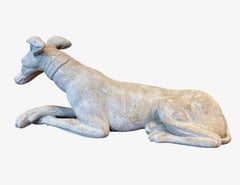Whippet sdraiato in terracotta