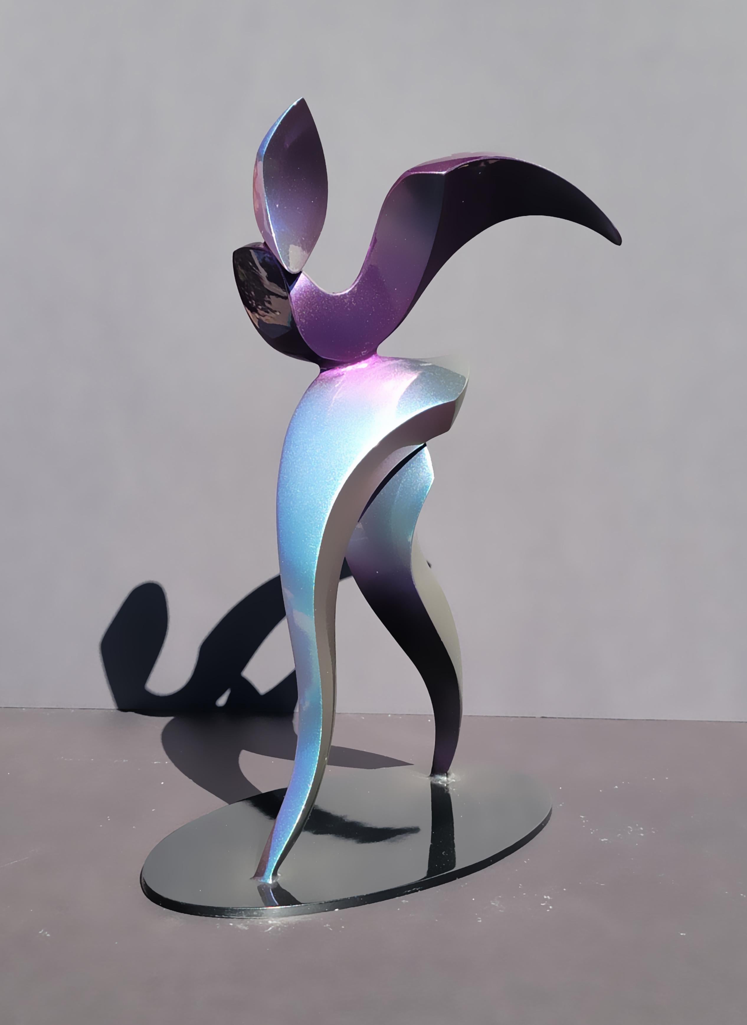 Cast in aluminum and painted with magenta-jade color this biomorphic figure seems in motion and color shifts depending on point of view and ambient lighting. This is an edition of 12 and is available in other colors or brushed aluminum.