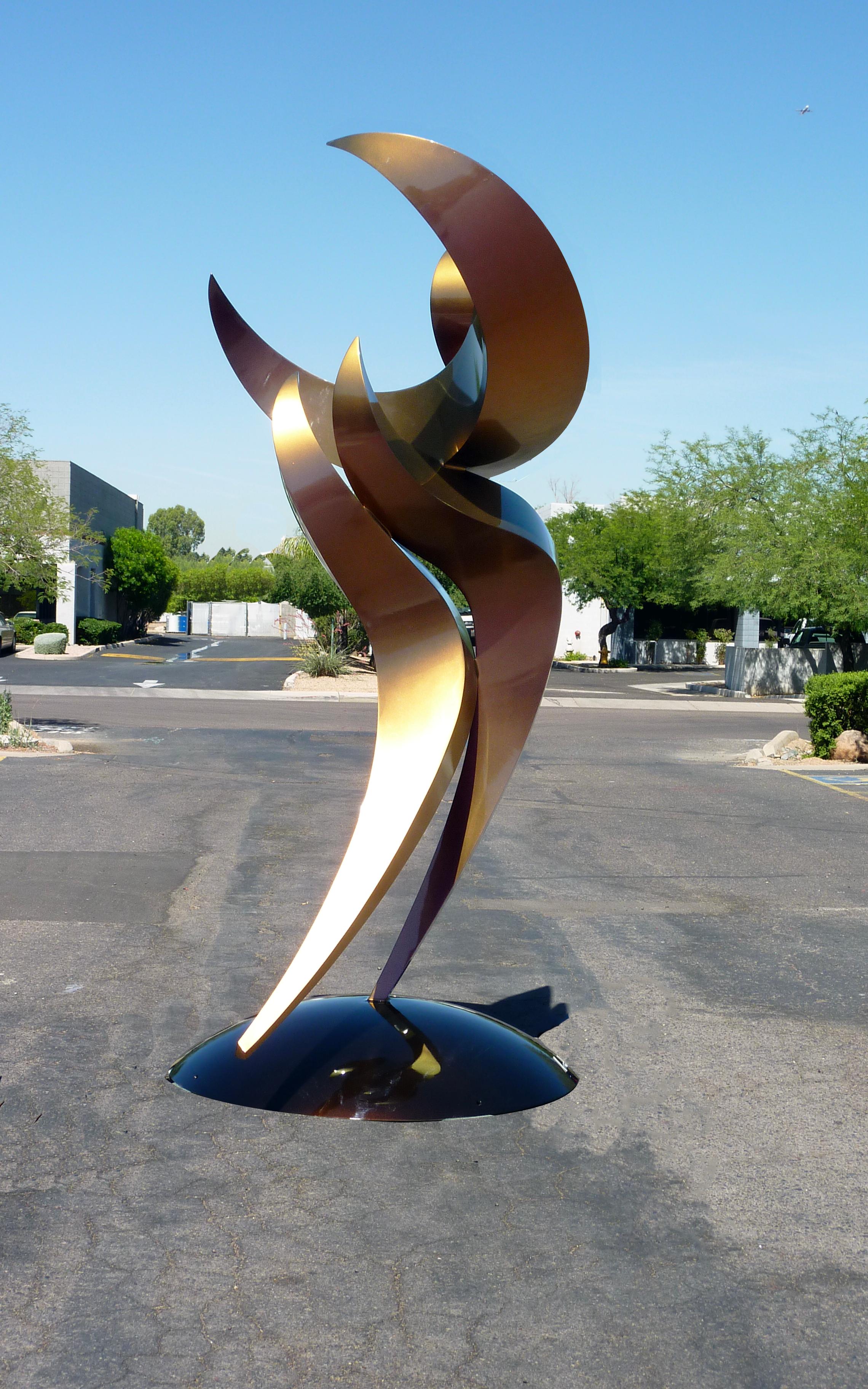 DANCER 6 is one of a series of dancing figures in a style best described as anthropomorphic abstraction.  The piece shown is 10 feet high and is made of aluminum with an automotive bronze/magenta color shift paint and a clear coat.  This piece is