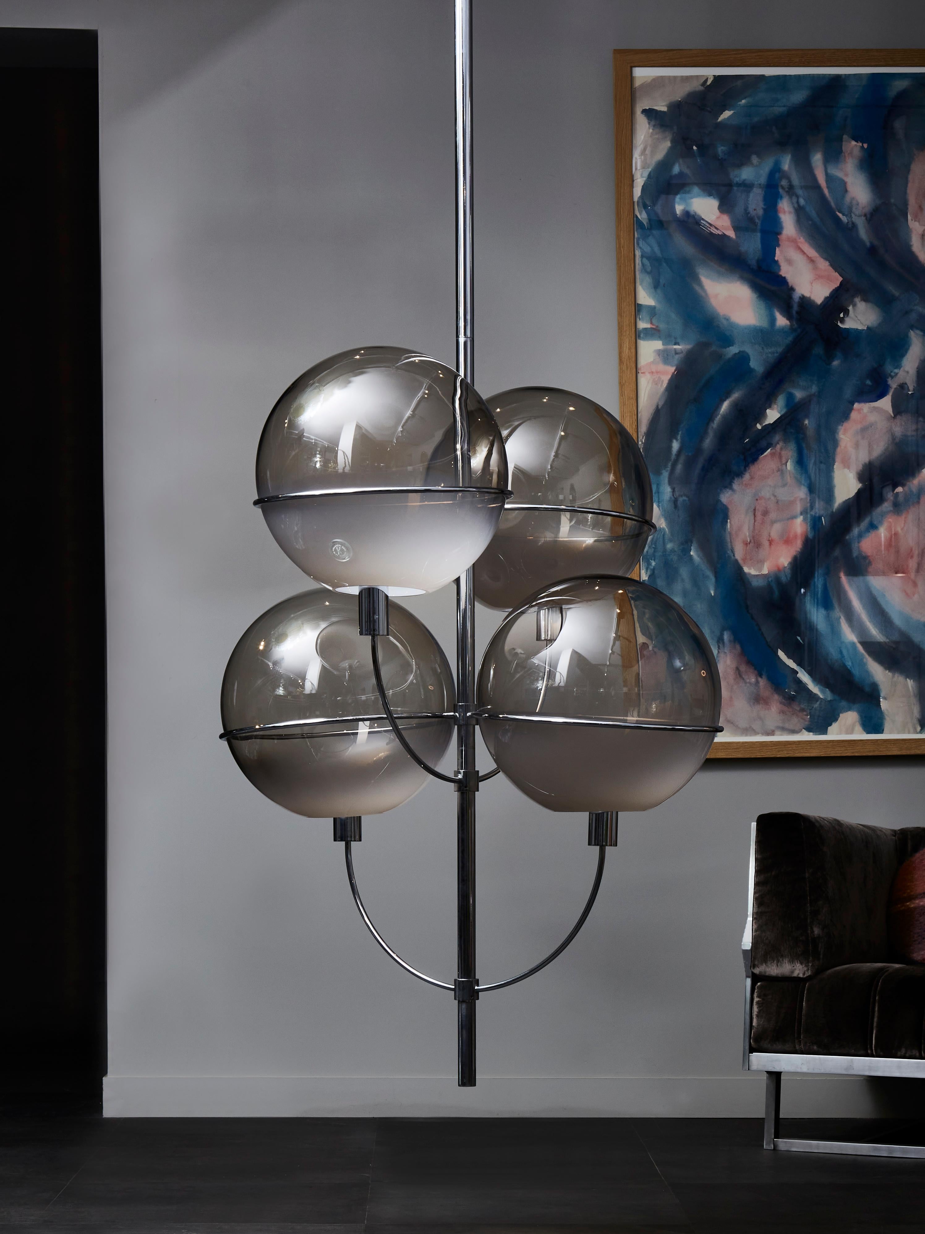 Tall Lyndon chandelier by Vico Magistretti, made of nickeled brass and smoked glass globes.