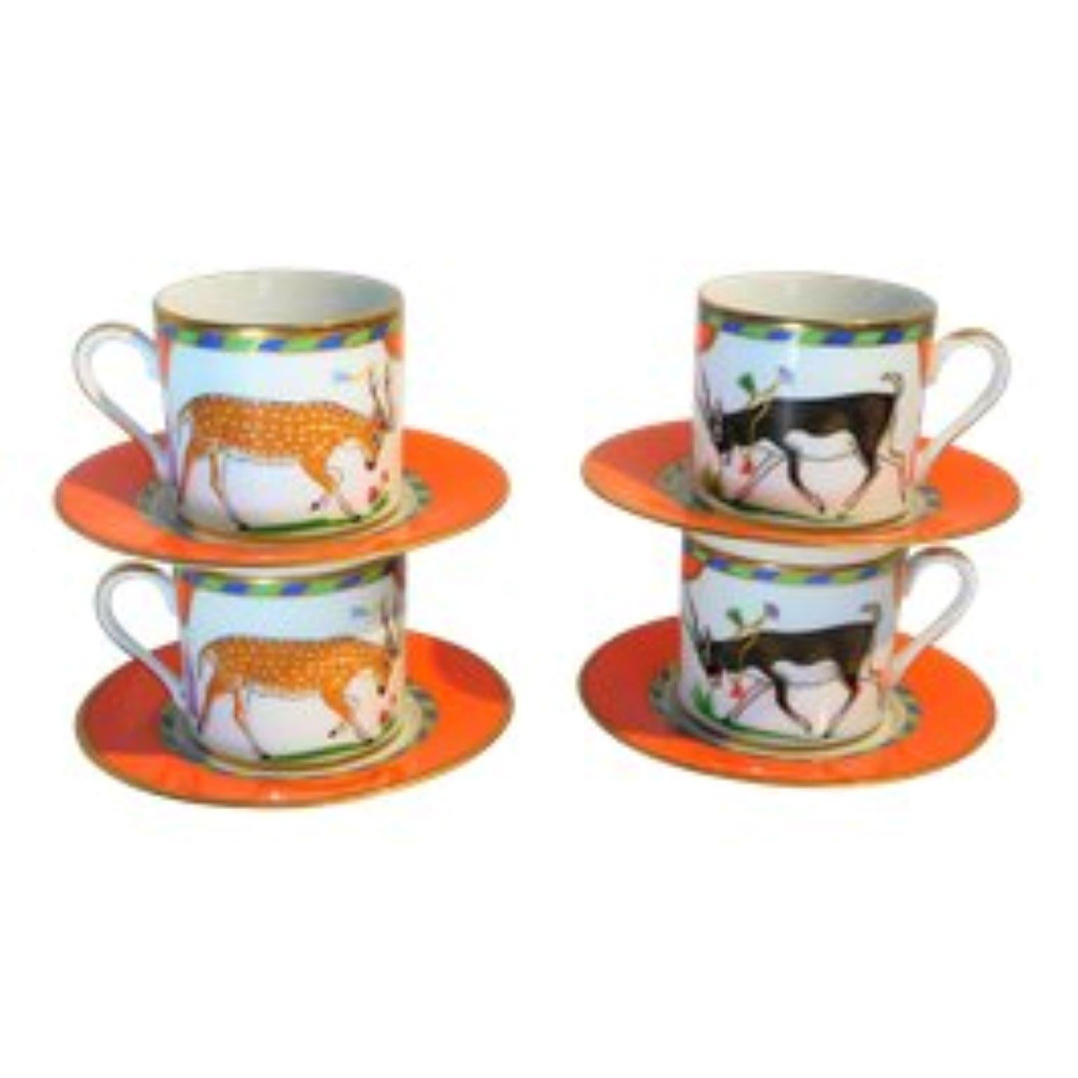 This colorful set of 4 demitasse cups and 4 saucers by Lynn Chase Designs, Inc. of Massachusetts, is expertly decorated in under-glaze colors trimmed with pure 24-karat gold. The colors include vibrant orange, blue, green, fawn, fuchsia, purple,