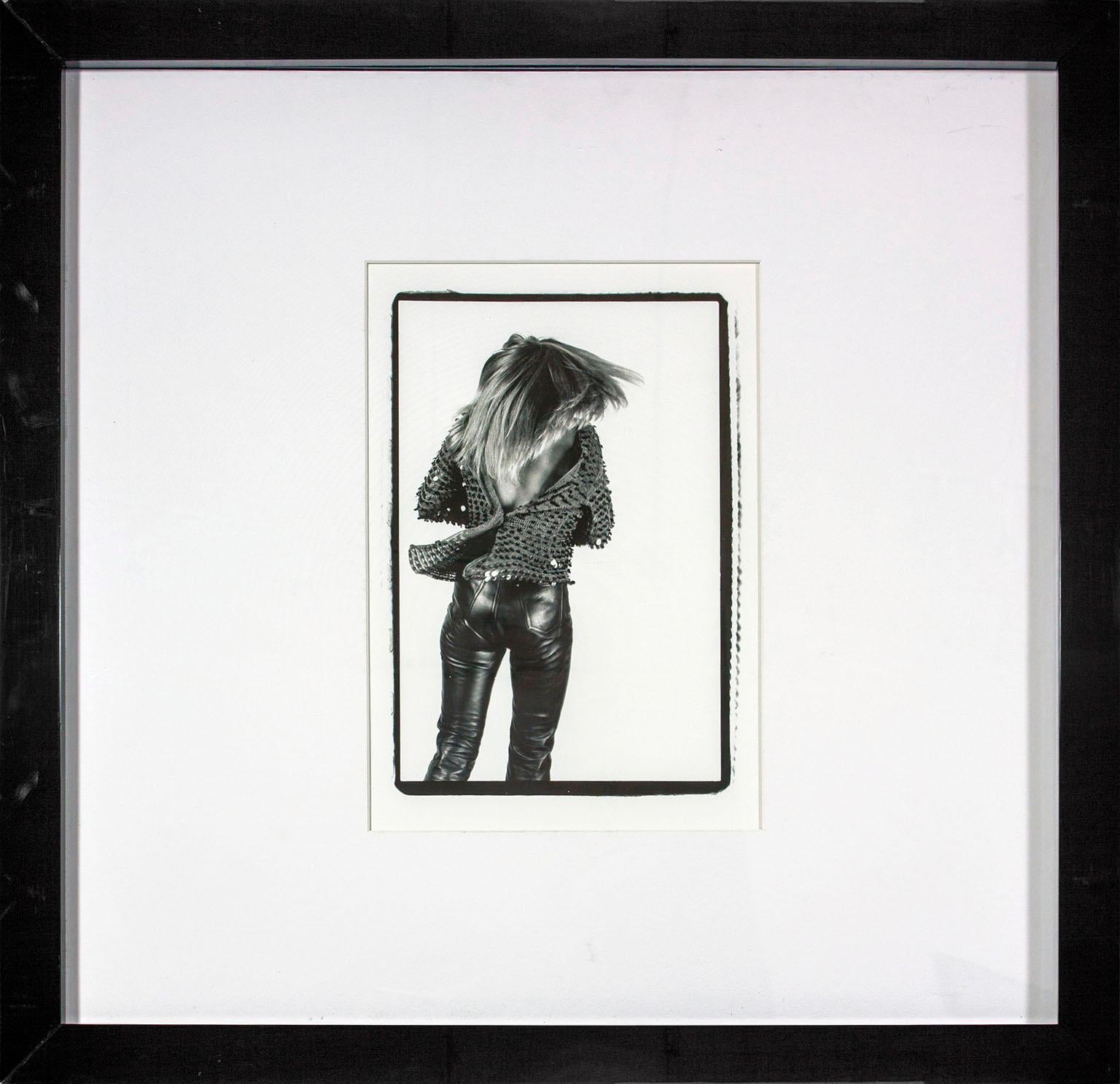 "Tina Turner 'The Back'" framed black and white photograph by Lynn Goldsmith. Image size: 15 1/2 x 10 1/2 inches. This photograph was previously displayed in a guest room of the original Hard Rock Hotel and Casino in Las Vegas, Nevada, and comes