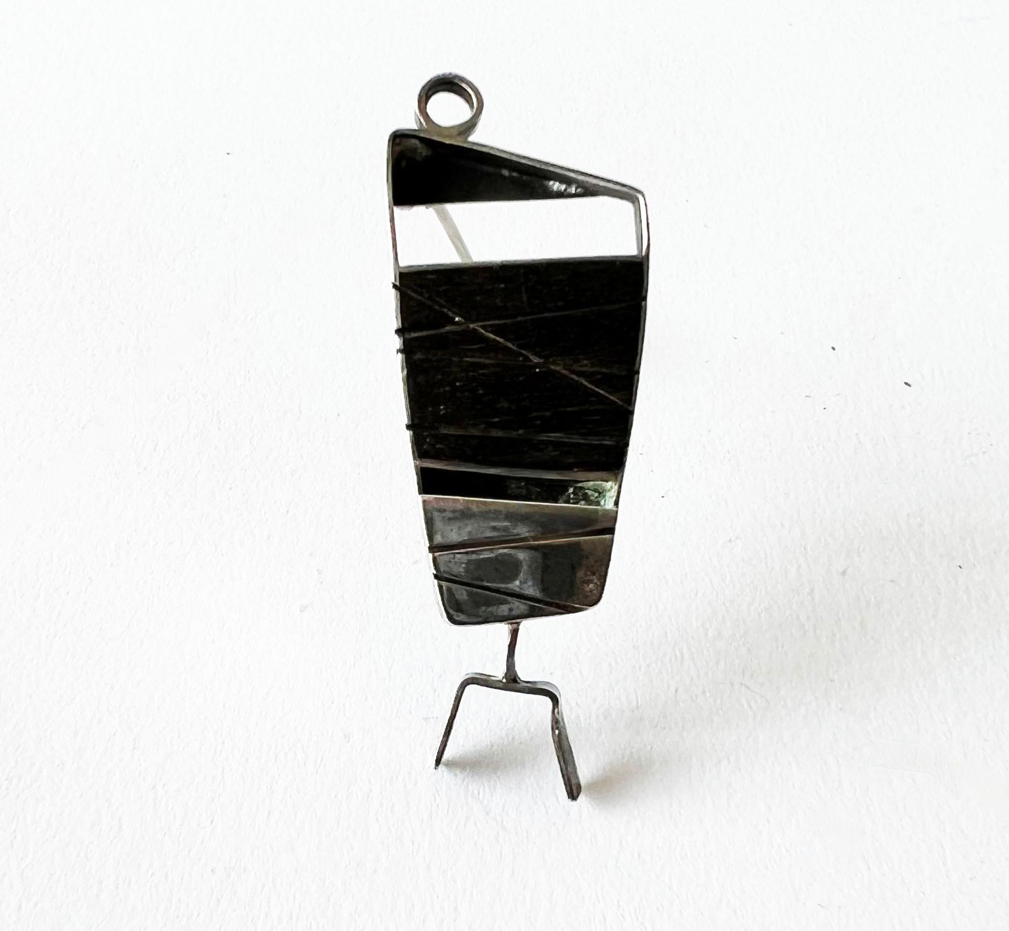 Sterling silver, and ebony inlay modernist fish brooch created by Lynn Rogers Porter, a student of Earl Pardon while at Skidmore College in Saratoga Springs, New York.  Brooch measures 1