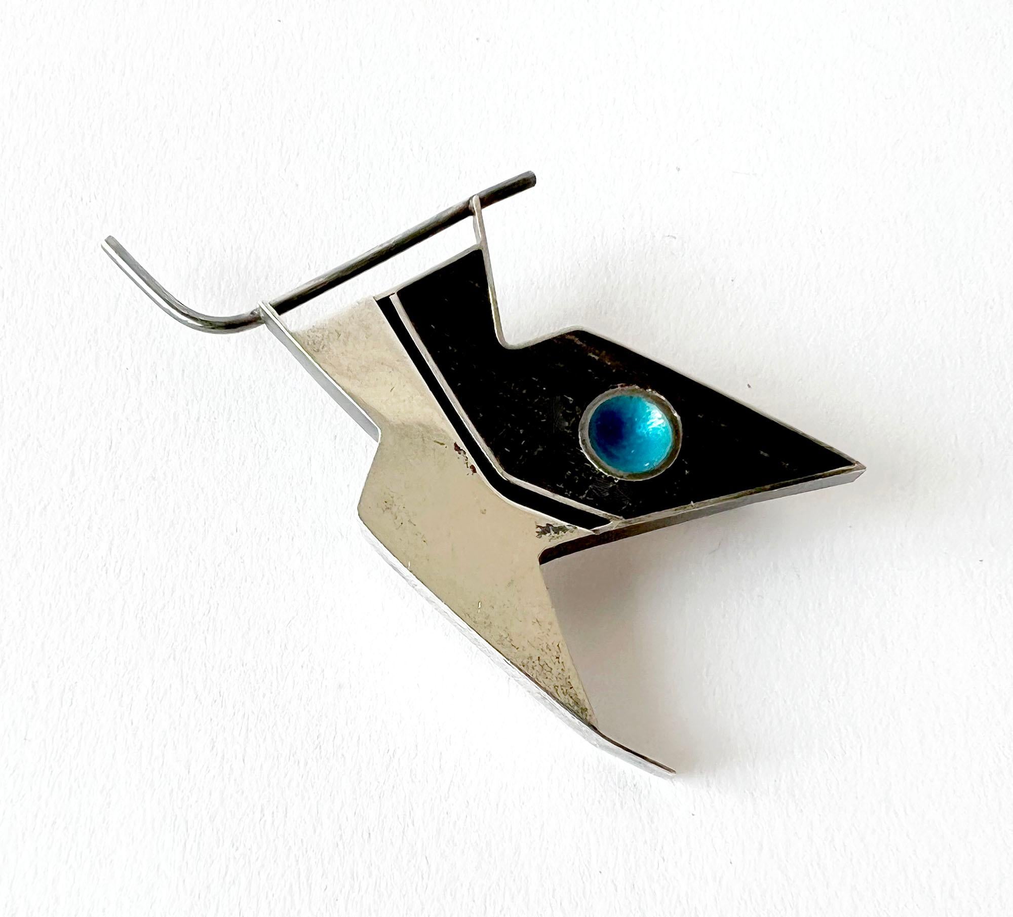 Sterling silver, ebony and enamel inlay modernist bird brooch created by Lynn Rogers Porter, a student of Earl Pardon while at Skidmore College in Saratoga Springs, New York.  Brooch measures 1.5