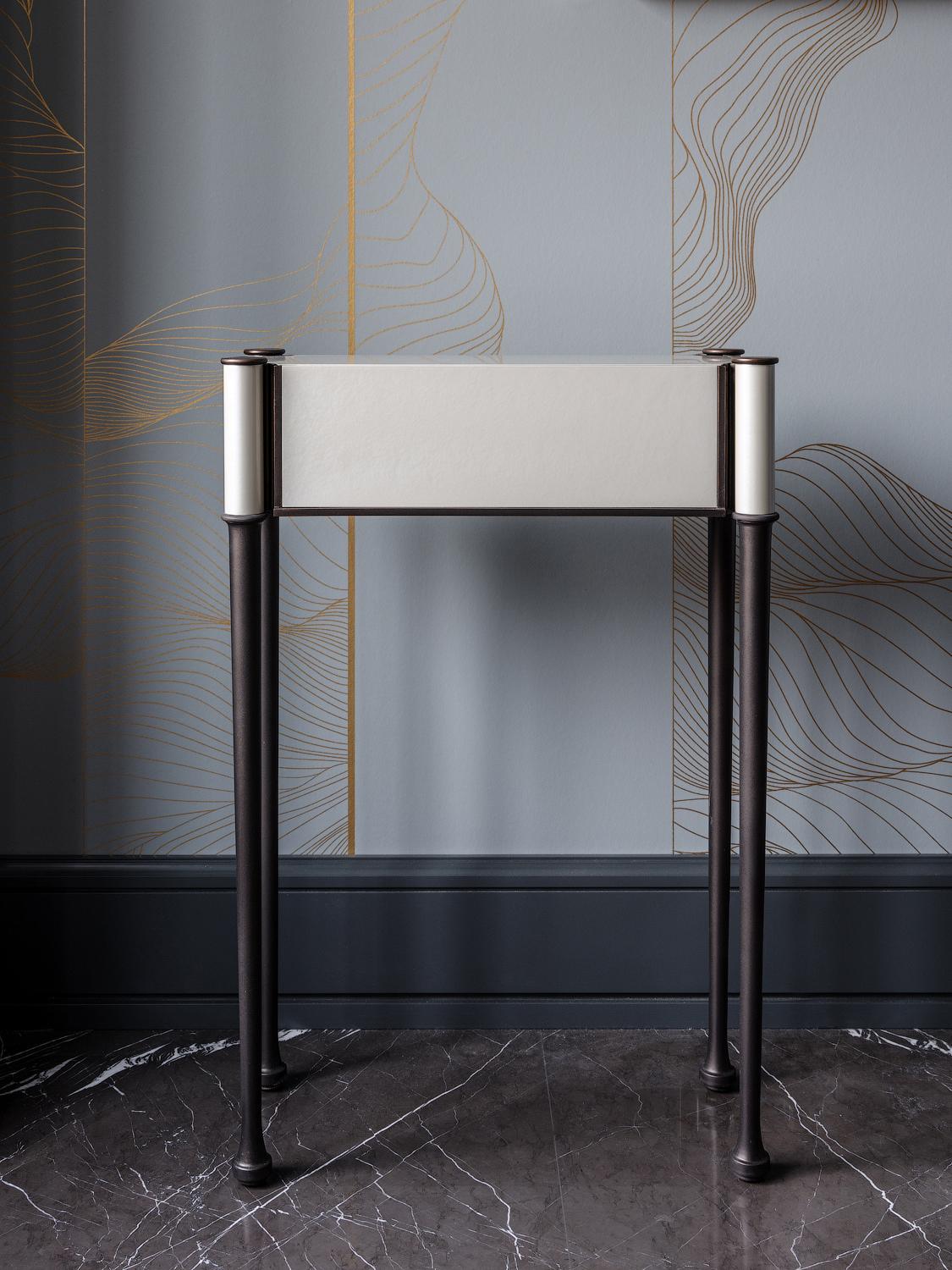 This miniature contemporary console will perfectly suit narrow spaces, for example, lobbies, corridors entrance halls. The rare combination of bronze and pearl sycamore finish makes it an exquisite complement to any modern interior. 


*Custom