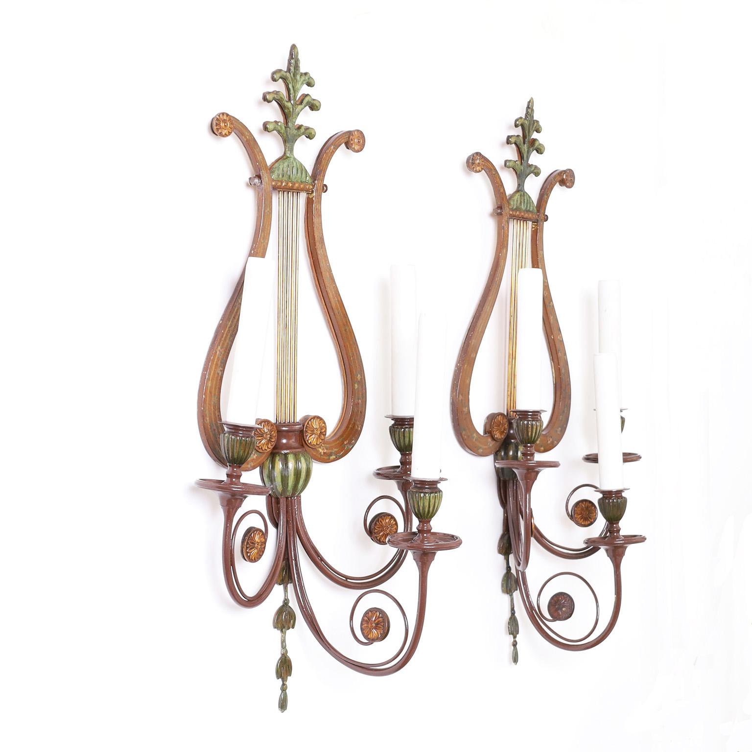 Antique pair of Adam style three light tole wall sconces crafted in metal with a lyre form. Made by the Sterling Bronze co. New York.