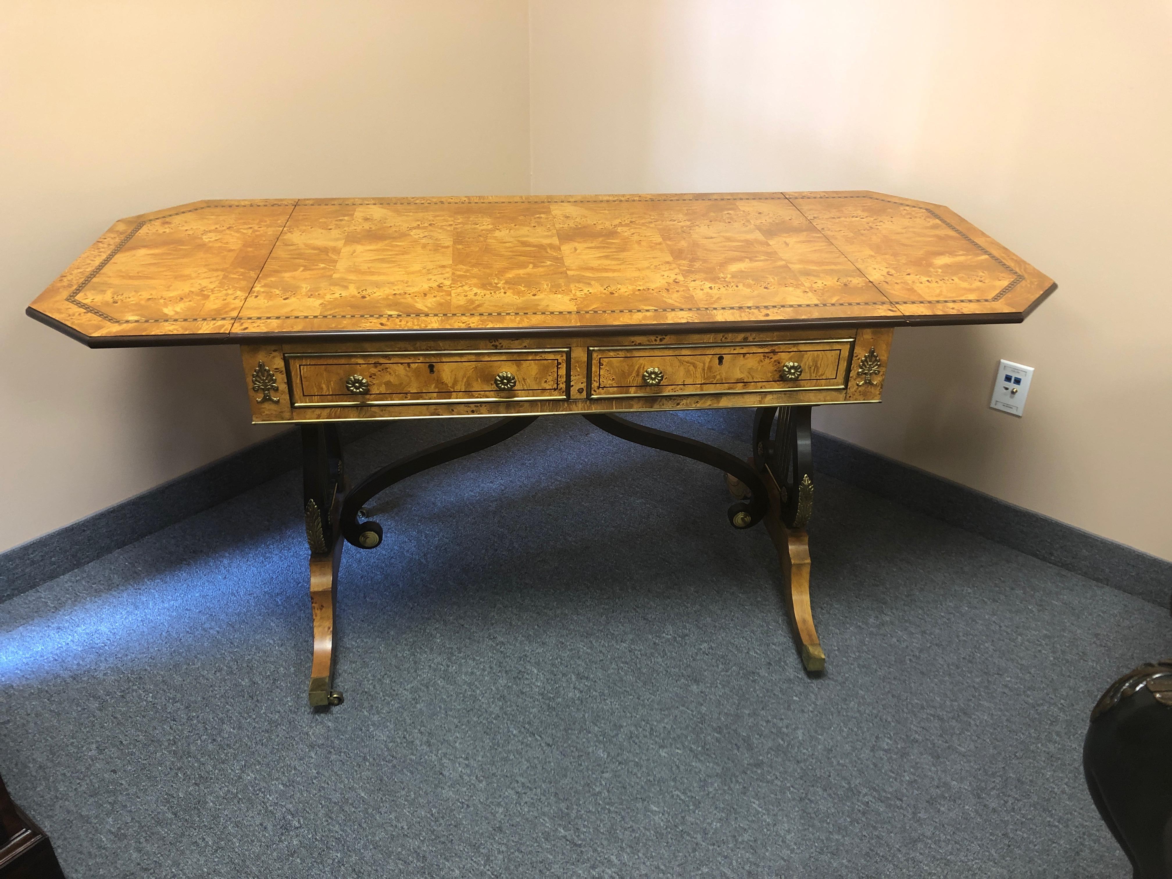 Startlingly beautiful bird’s-eye maple drop-leaf writing desk having gorgeous satinwood and ebony inlay and elegant detailed lyre motife legs.
with leaves open 64.5 W.