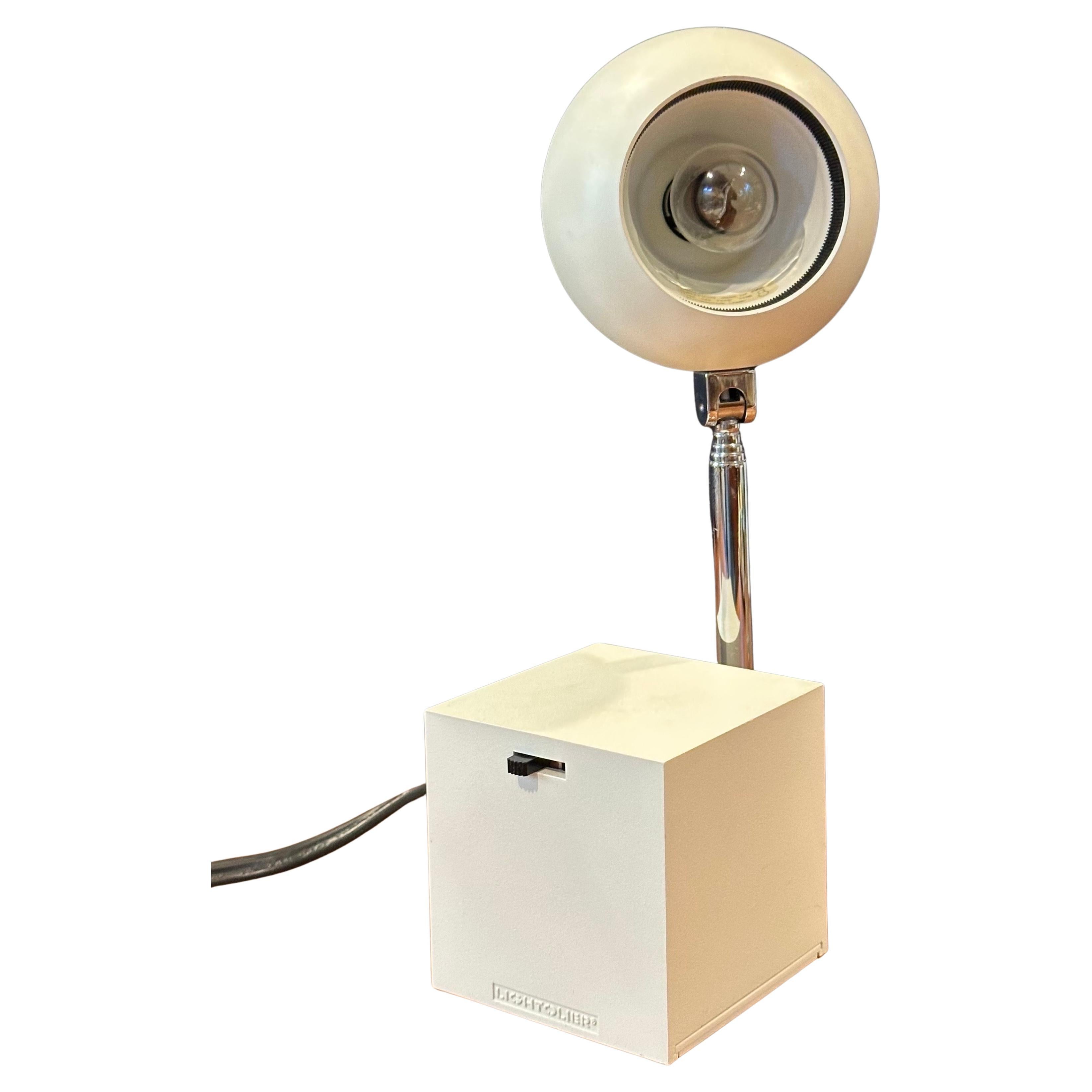 A very nice Lytegem desk lamp in off-white with spherical metal shade, cube base and chrome arm designed by Michael Lax for Lightolier, circa 1990s. The lamp was named by the late Industrial designer Jay Doblin as one of the 20th century's hundred