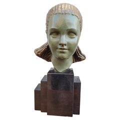 Tête d'une jeune femme, bronze Art déco, 20e siècle