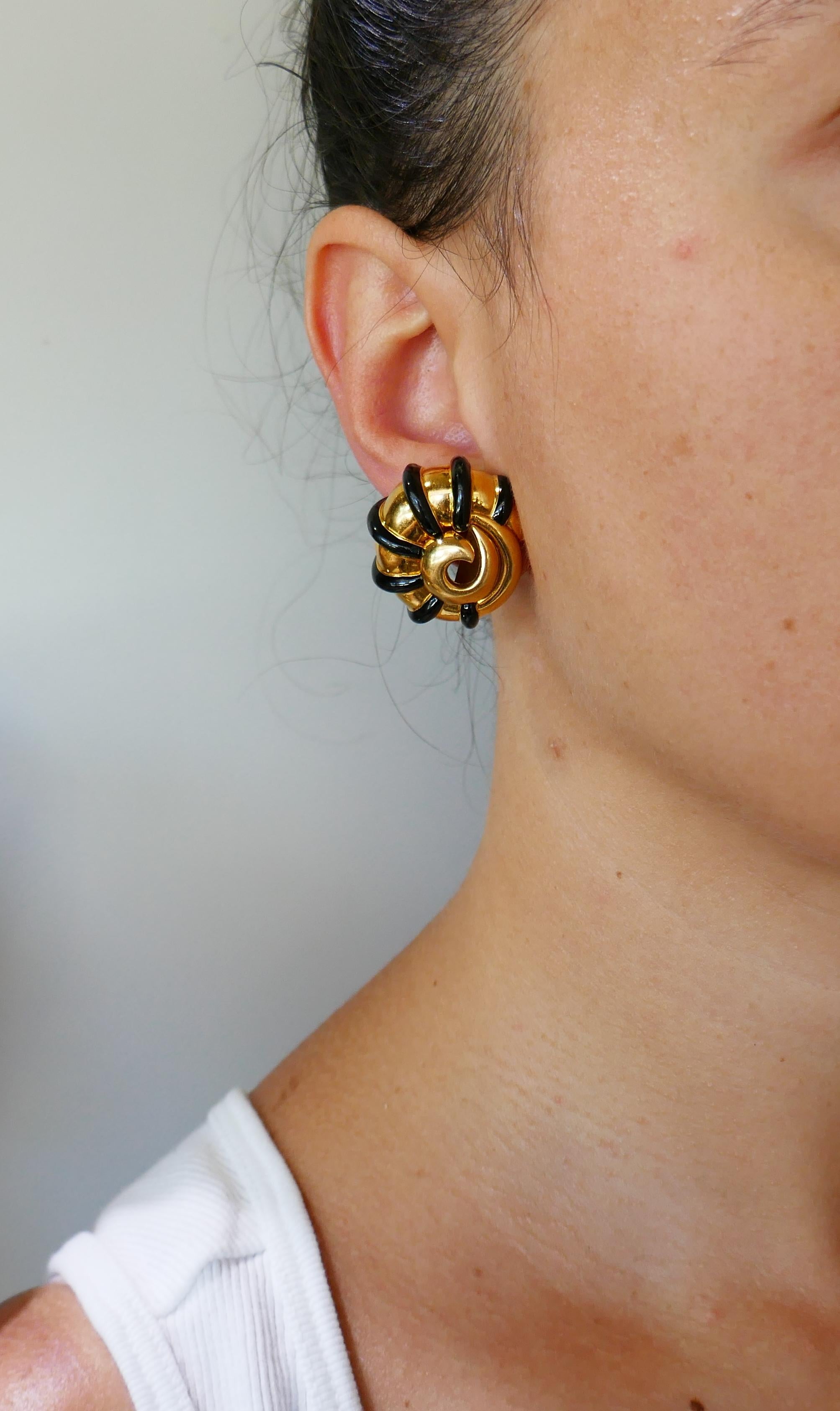 Edgy yet elegant pair of earrings created by Marilyn Cooperman in the 1980s.  Stylish, chic and wearable, the earrings are a great addition to your jewelry collection. 
The earrings are made of 18 karat yellow gold and black enamel.
The earrings