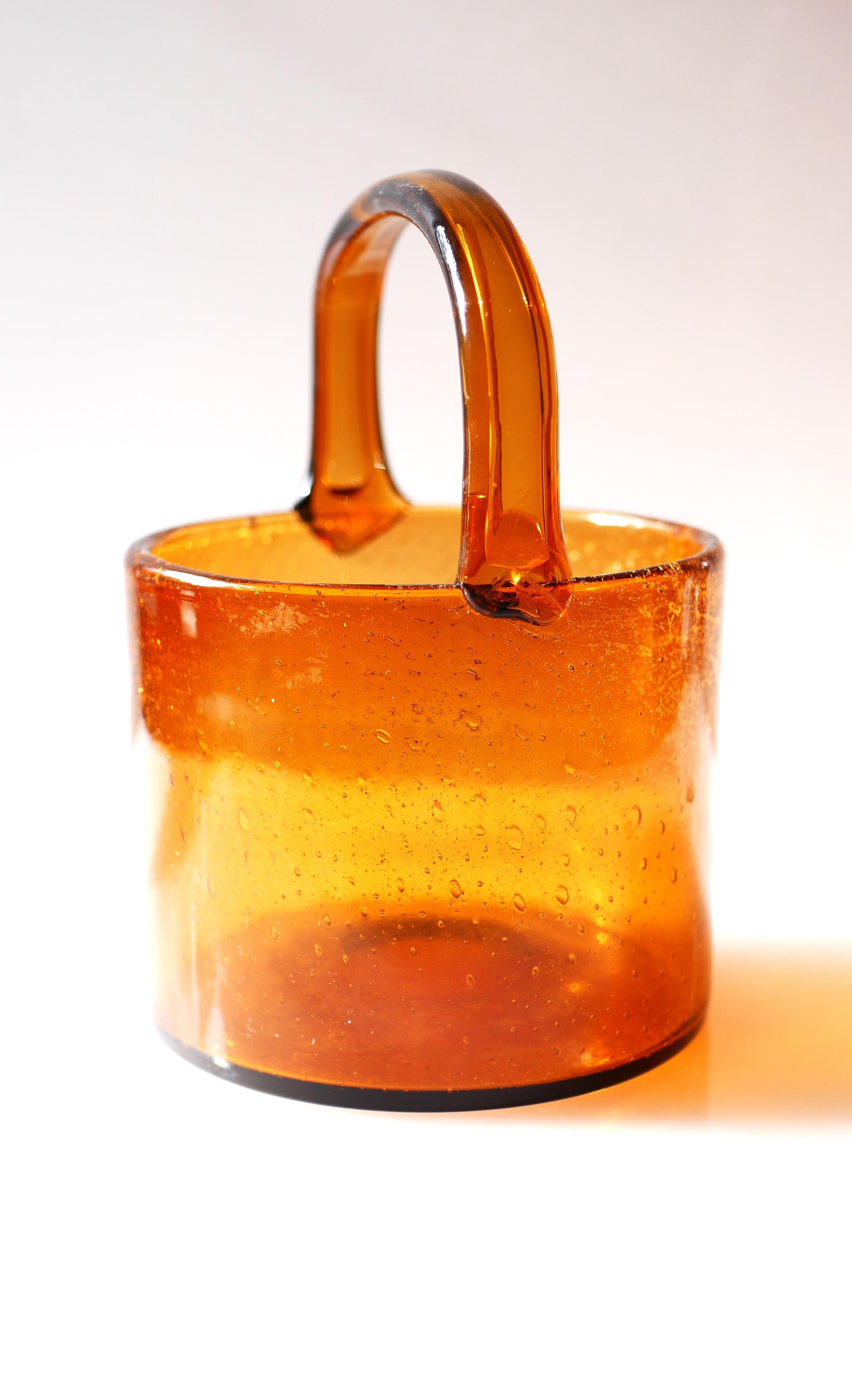 A fantastic vintage hand-blown ice-bucket known as 