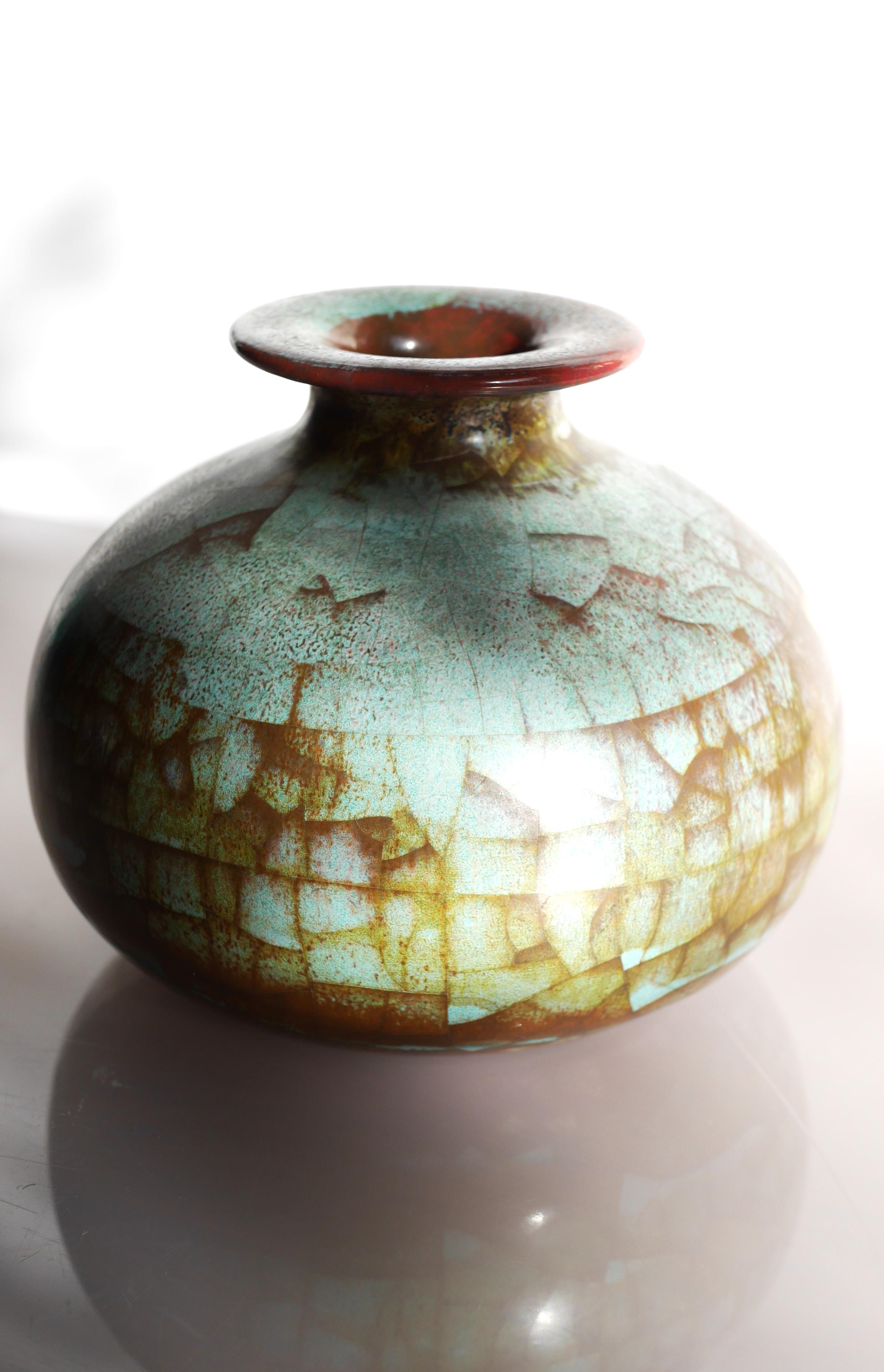 An extraordinary vintage ceramic vase with Persia glaze from Michael Andersen, Bornholm, Denmark. An unusual and stunning ceramic vase with fantastic colors with parts of if being a pale green color matched with a bronze brown tones in a patchy