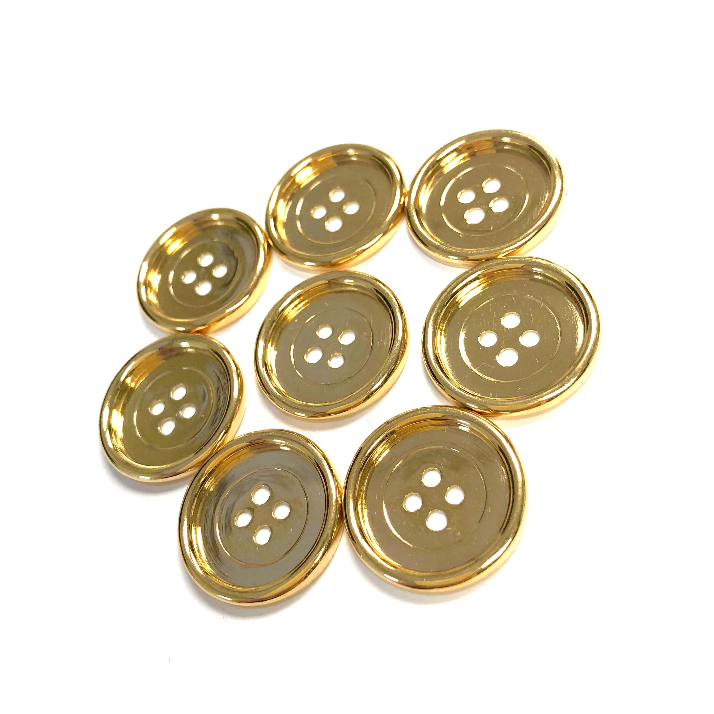 Set of 8 vintage round, high polished 18K gold buttons by M. Gerard Paris. Each button measures 22.5mm in diameter with a 2.5mm doughnut style rim.
Total weight: 47 grams
Marked: M. Gerard, serial number, French assay and maker's marks.
Condition: