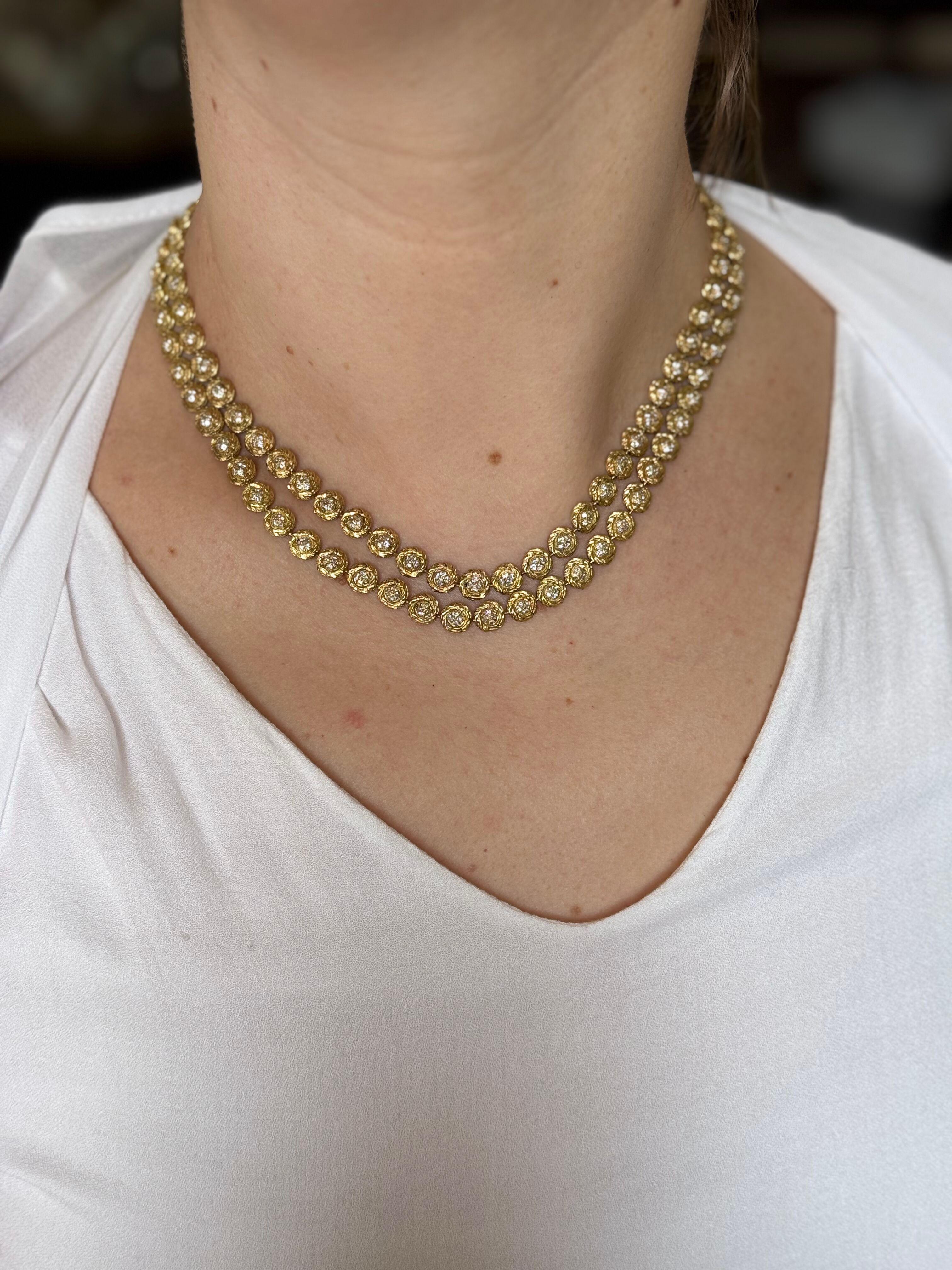 Un collier à deux brins en or jaune 18k par M. Gerard, présentant un total d'environ 2.50ctw SI/H. 
Le collier fait 17