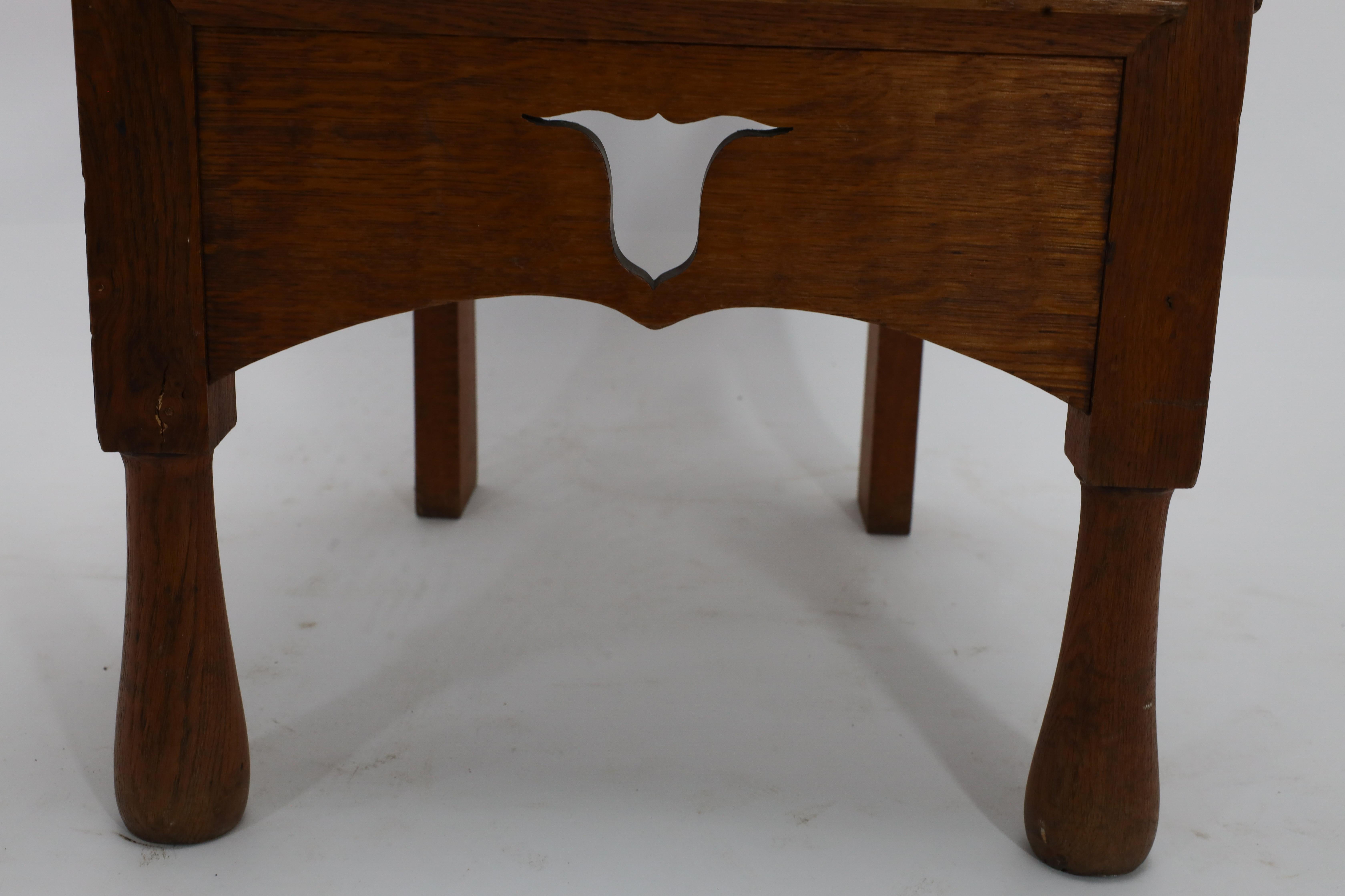 M H Baillie Scott attri An Arts & Crafts Oak Chair With Stylised Floral Cut-Outs For Sale 3