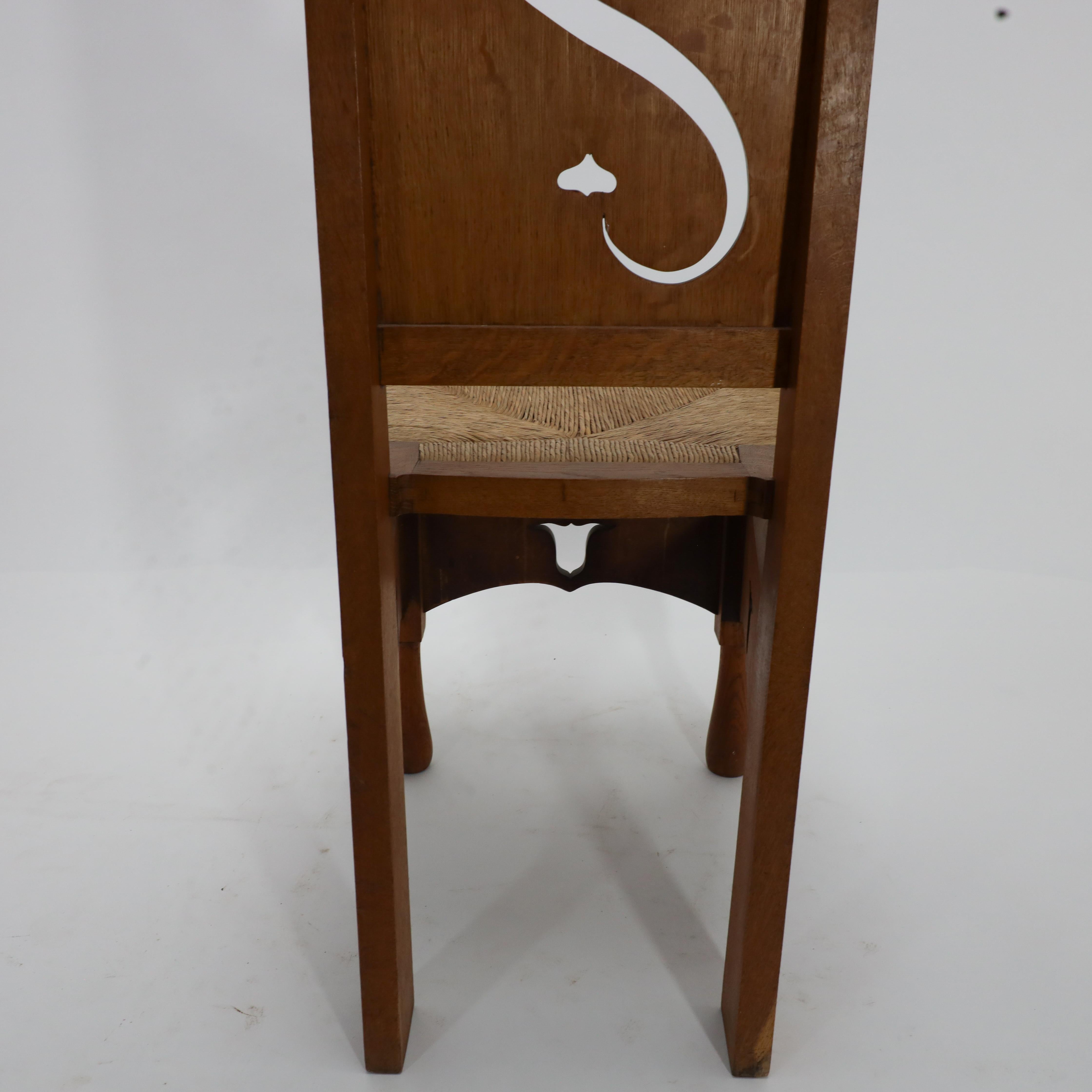 M H Baillie Scott attri An Arts & Crafts Oak Chair With Stylised Floral Cut-Outs For Sale 7