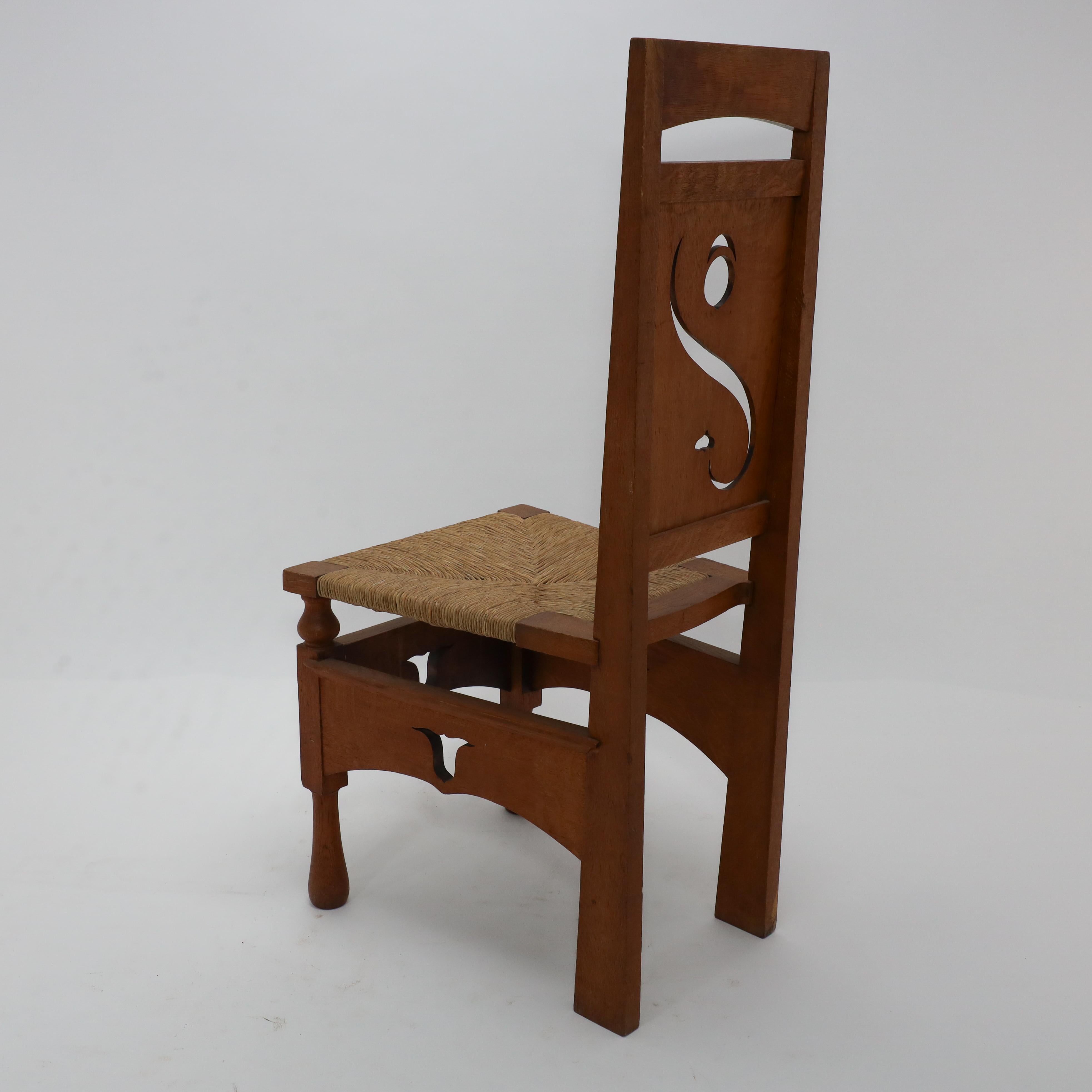 M H Baillie Scott attri An Arts & Crafts Oak Chair With Stylised Floral Cut-Outs For Sale 9
