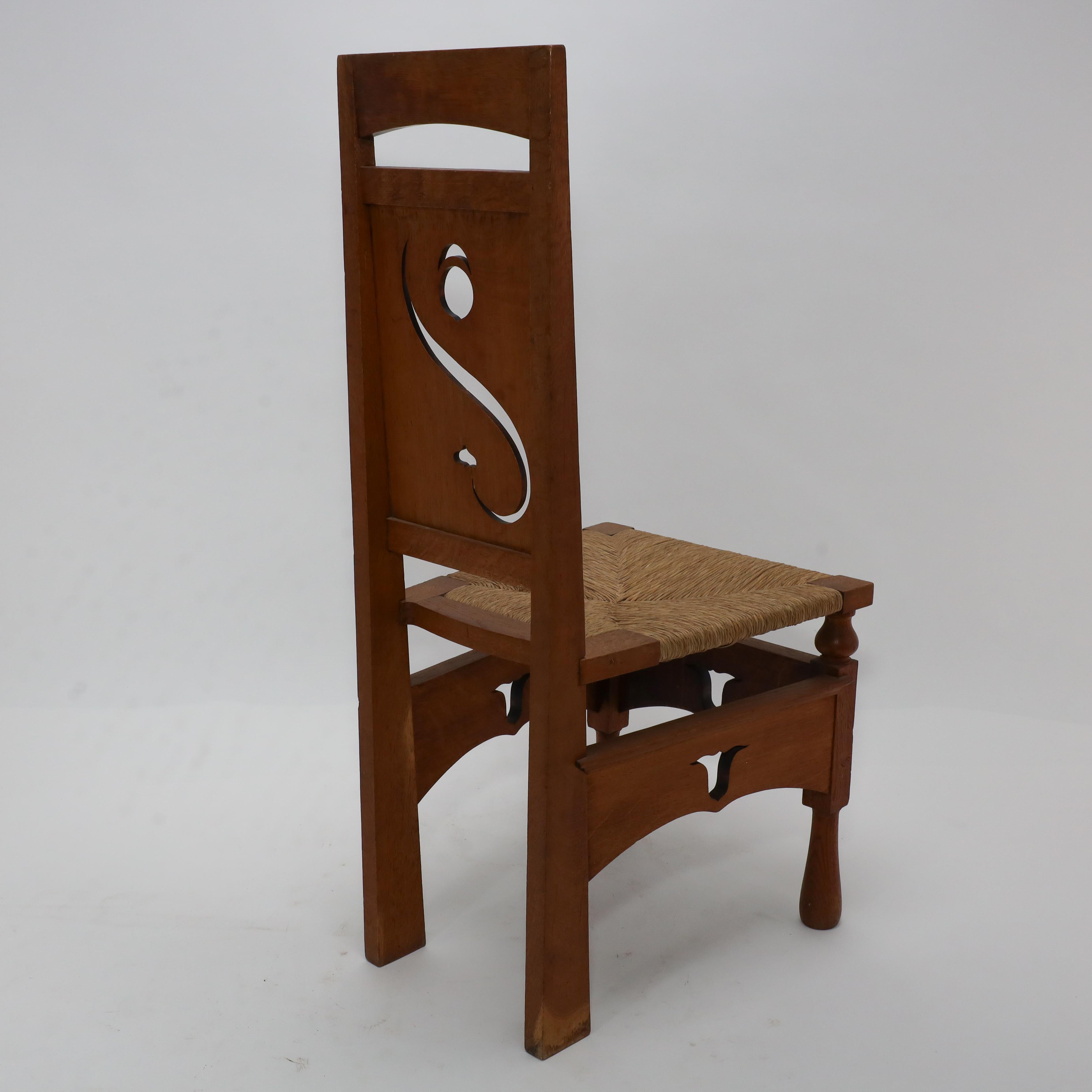 M H Baillie Scott attri An Arts & Crafts Oak Chair With Stylised Floral Cut-Outs For Sale 11