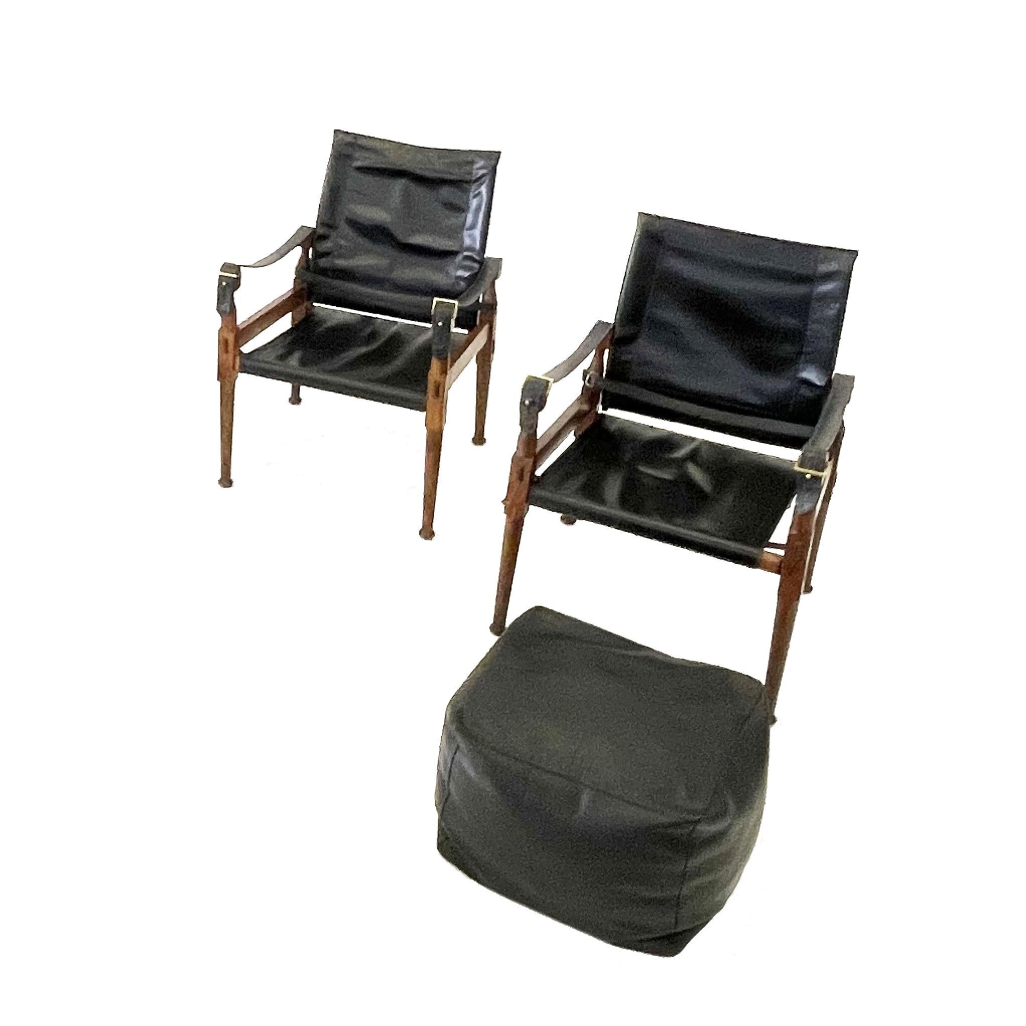 'Safari' lounge chairs and ottoman, wood, black leather and brass, Pakistan, 1970s
Two chairs and one Ottoman

This 'Safari' armchair shows very elegant and well designed lines, in combination with carefully crafted wood joints. The black leather