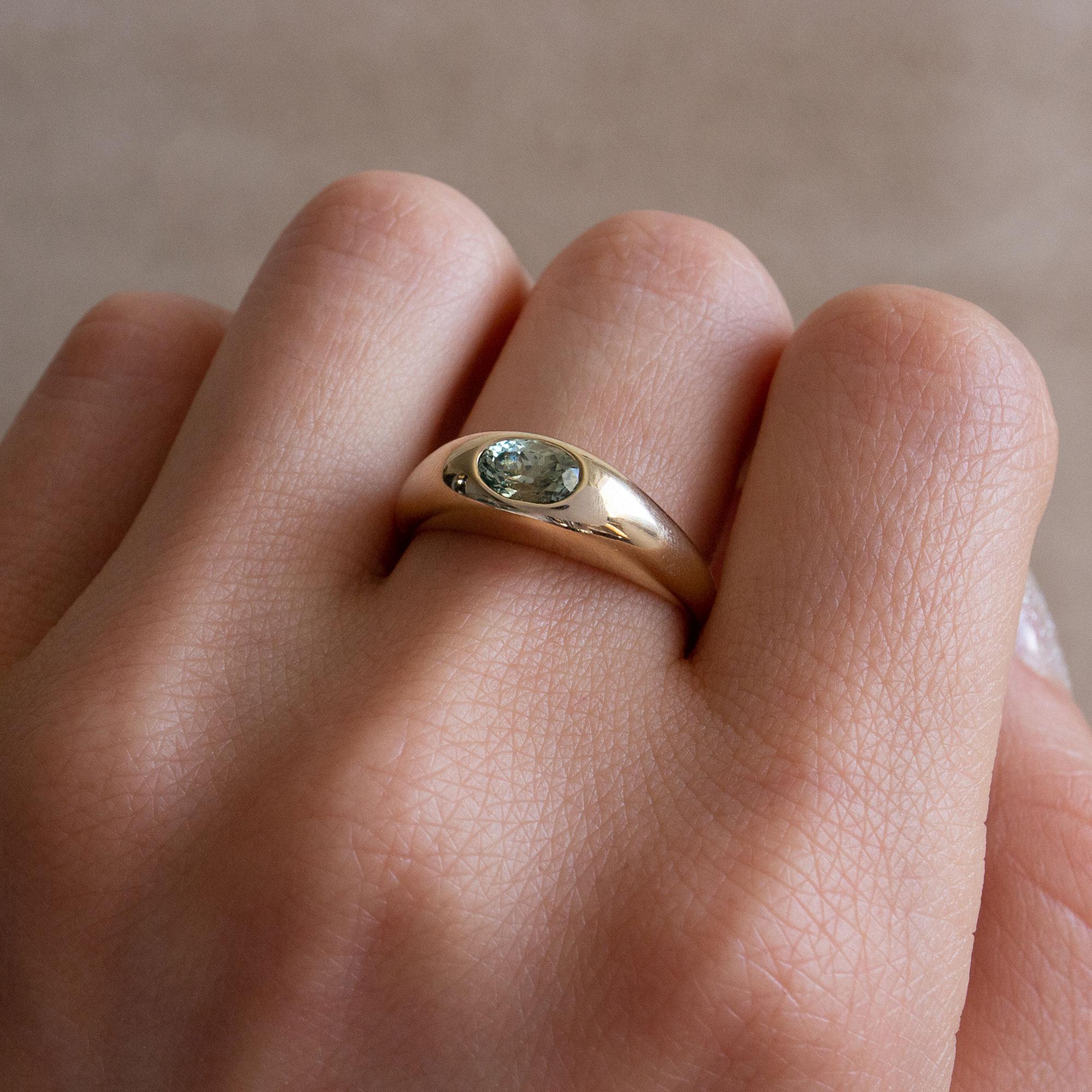 Risa is a solid, signet-style ring with a soft, smooth touch. The original inspiration came from an early 14th century British stirrup ring. I plumped it up to add a luxurious weightiness and added a pool of color at is peak.

0.6CT LIGHT GREEN