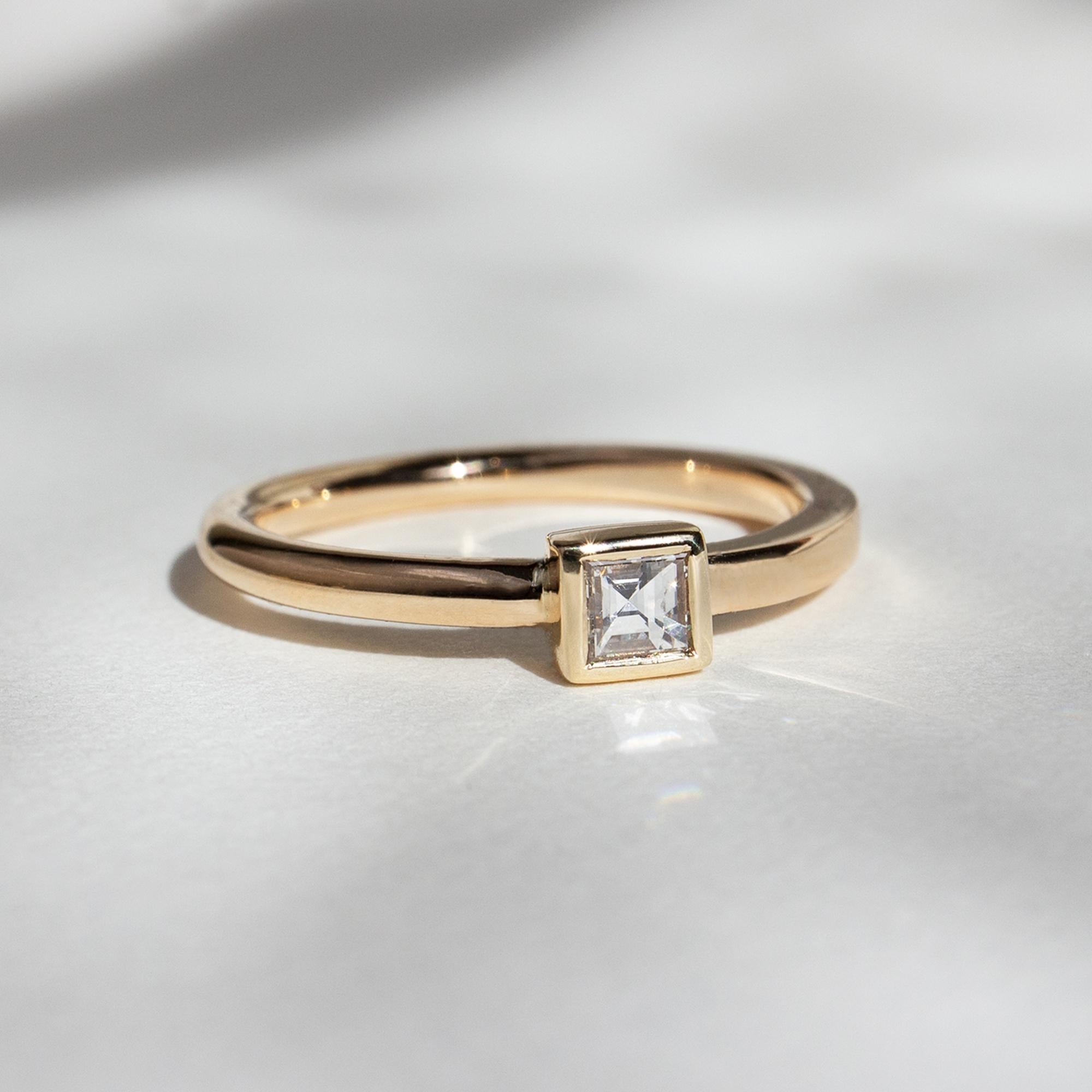 The dynamic band, an M. Hisae signature, now as a stand-out solitaire. A beautiful genesis of movement out of static, geometric forms. The Carré Cut is an original antique.

14K YELLOW GOLD
US RING SIZE 6
READY TO SHIP
*Resizing may be possible.