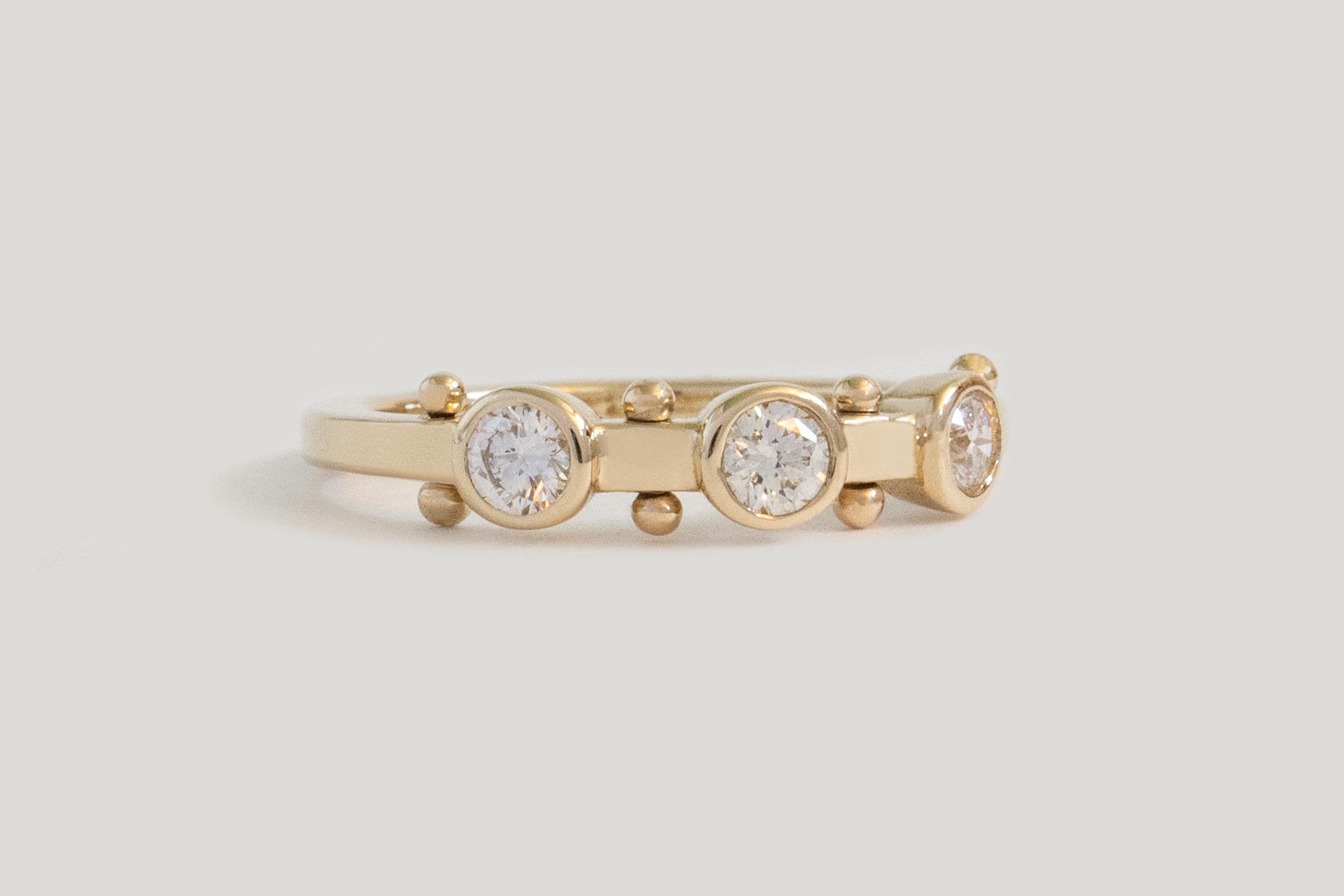 A patchwork of sensory elements, creating a liveliness easier felt than described. Like stepping stones on a path to forever love.

STONES
◘  3x 3mm reclaimed White Diamonds (SI, G-H)
◘  Approx. 0.32 total carat weight

MATERIAL
◘  Bead elements