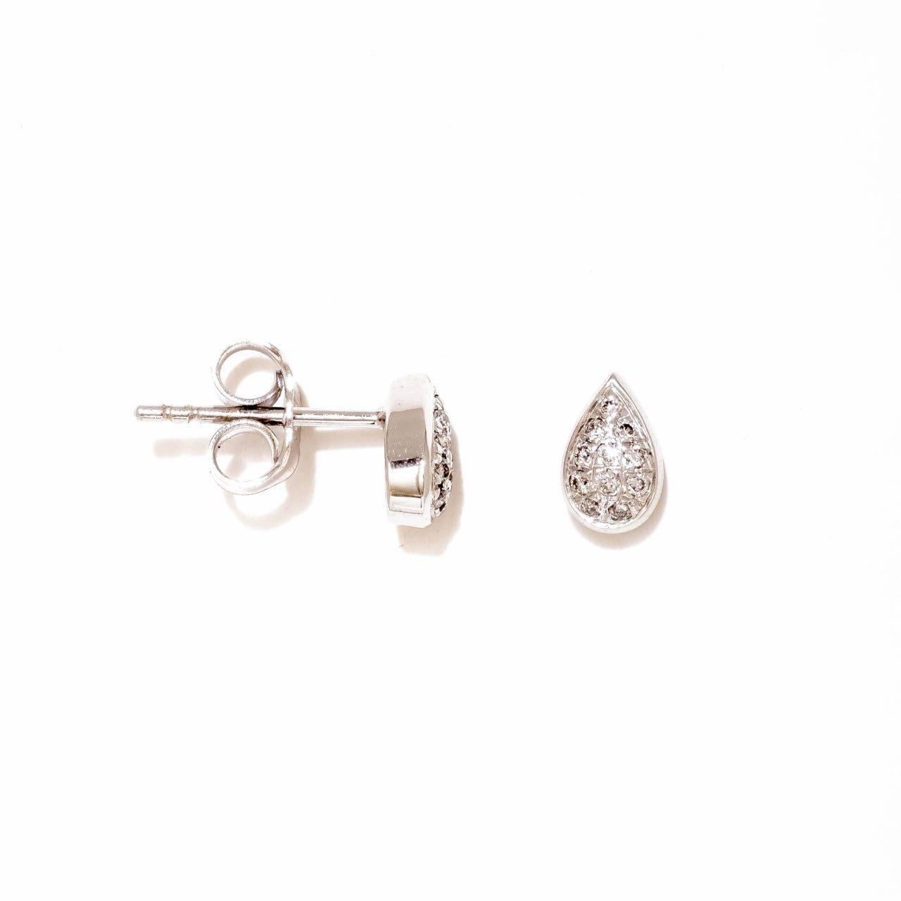 18K white gold, full cut round diamonds weighing 0.132cts. These are slightly domed pear shaped micro pave set diamond stud earrings with butterfly closures. Signed by M. Khatau, hallmarked and presented in a special handmade box. 