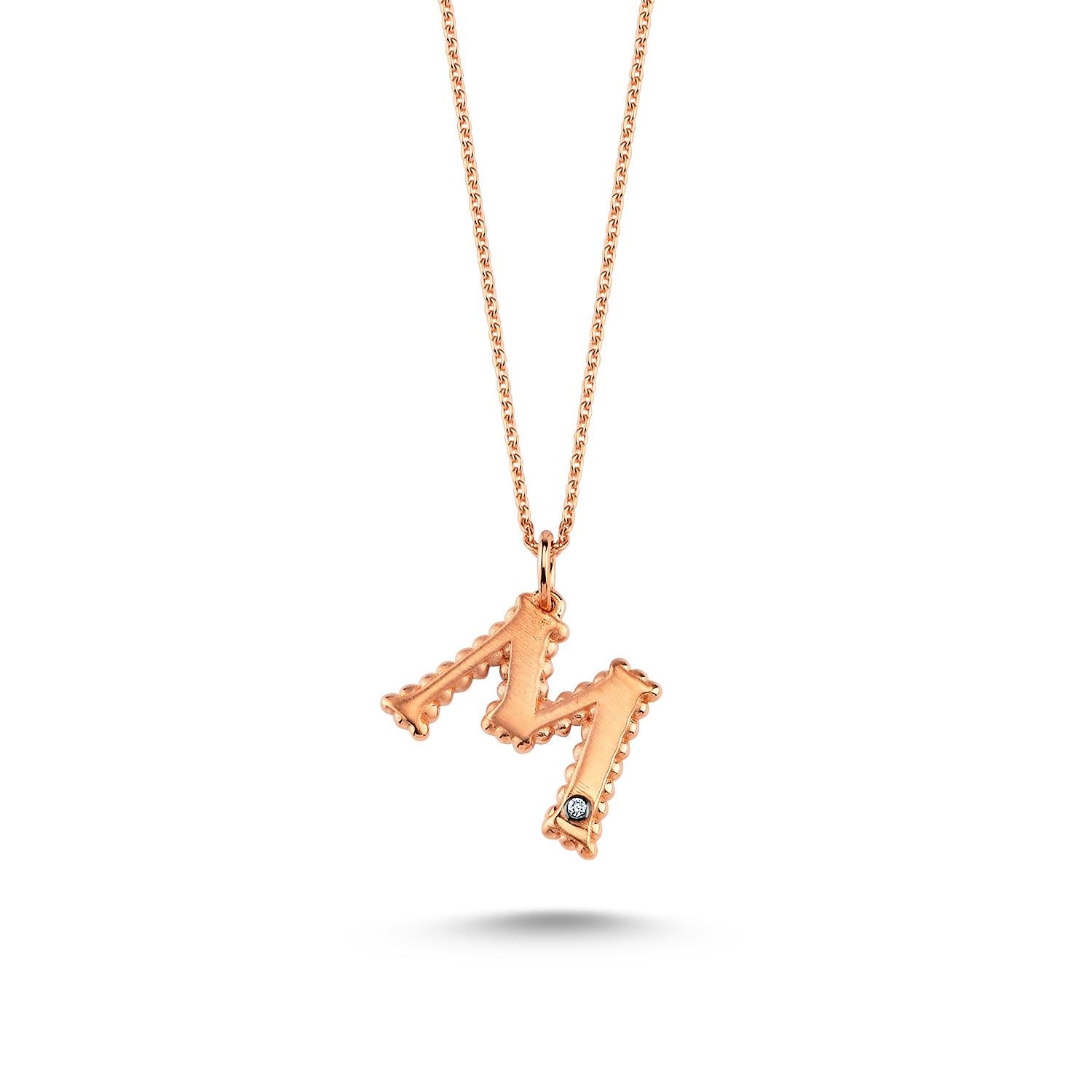 M large necklace in 14k rose gold with white diamond by Selda Jewellery

Additional Information:-
Collection: Letter Collection
14k Rose gold
0.01ct White diamond
Pendant height 1cm
Chain length 44cm