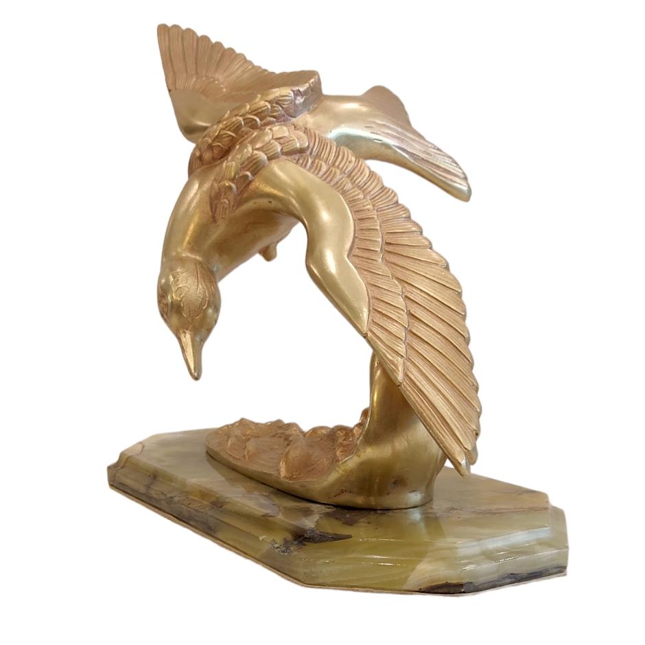 Beautiful large Art Deco object. A seagull flies over the waves of the sea. This sculpture is atributed M-LEDUCQ. Unsigned.
