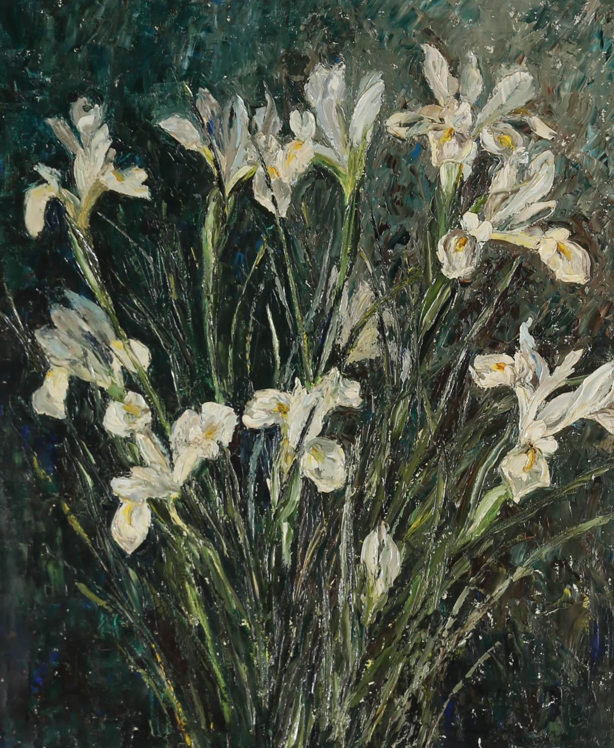 This captivating oil shows a spray of white irises, blossoming from a mass of slender leaves. The painting has been signed to the lower left with the impasto piece elegantly presented in a contemporary frame and slip. On canvas on stretchers. 
