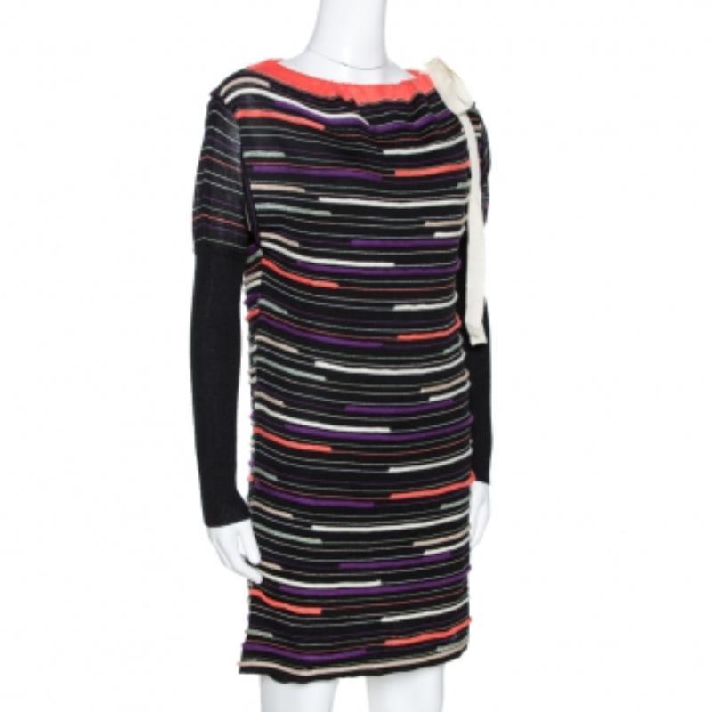 Make an impressive style statement with this stunning mini dress from the house of M Missoni. This fancy black attire is sure to make you a show stopper no matter what the occasion is. This merino and angora wool dress is skillfully designed to