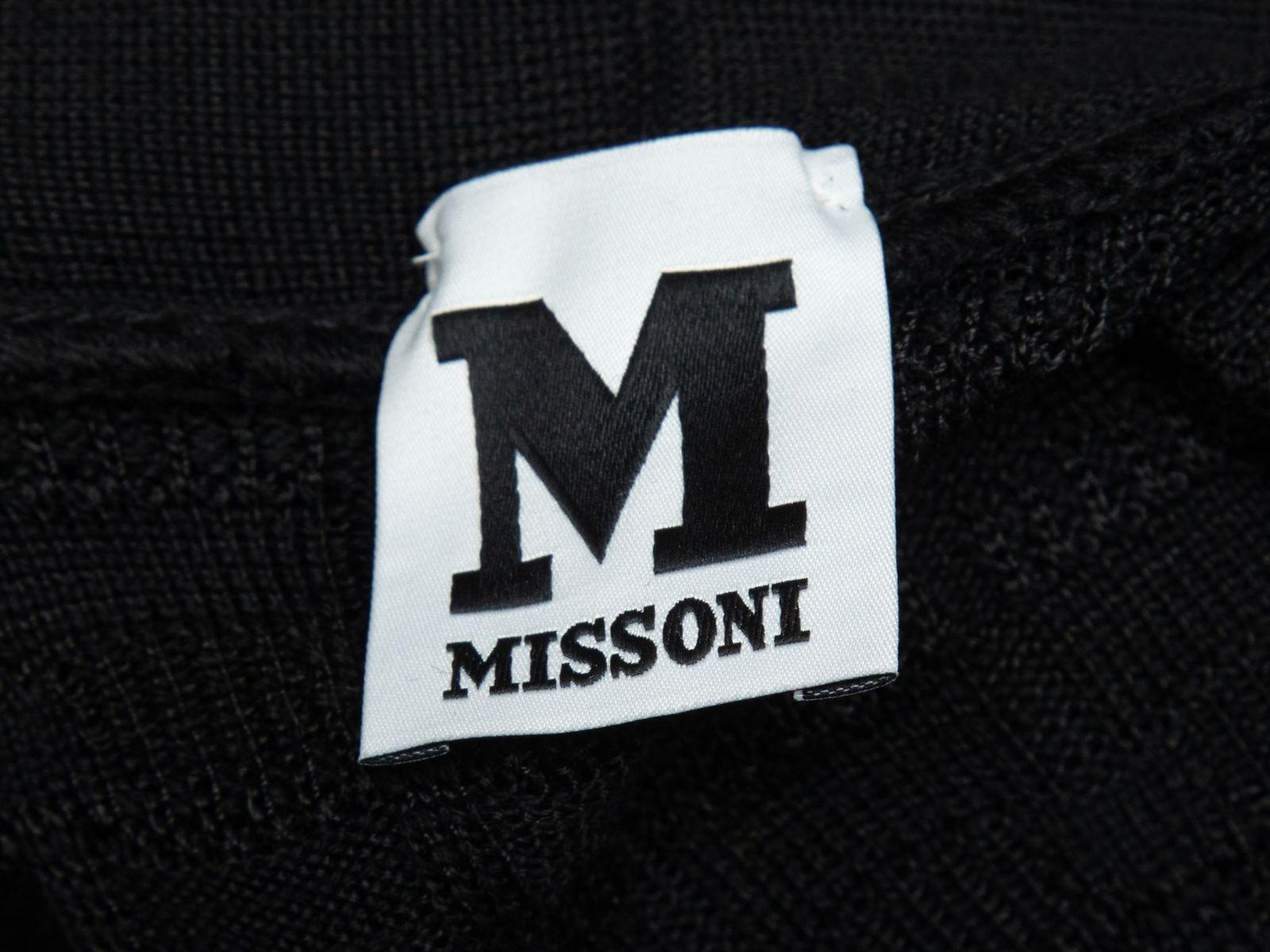 Product Details: Black longline cardigan by M Missoni. V-neck. Concealed front closure. Designer size 48. 46