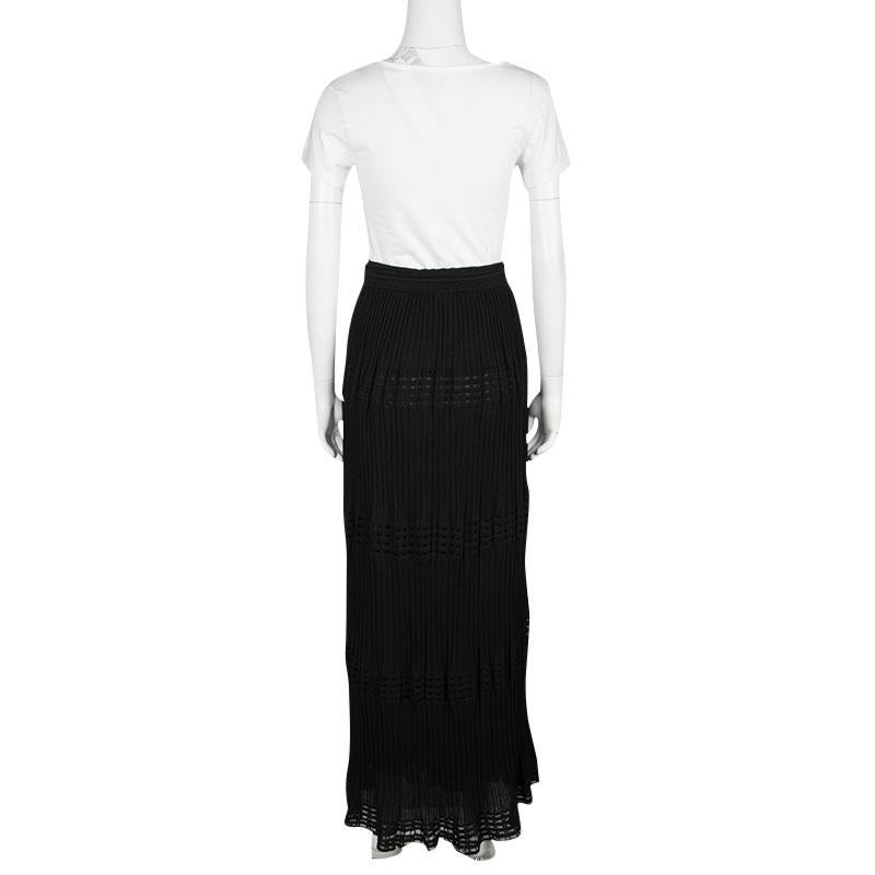 Knitted in a perforated pattern, this black skirt from M Misson is ideal for an effortless evening look. Cut from a cotton blend, the skirt can be worn for ease and comfort. It has a maxi length and features a sleek pleated design with tie detail at