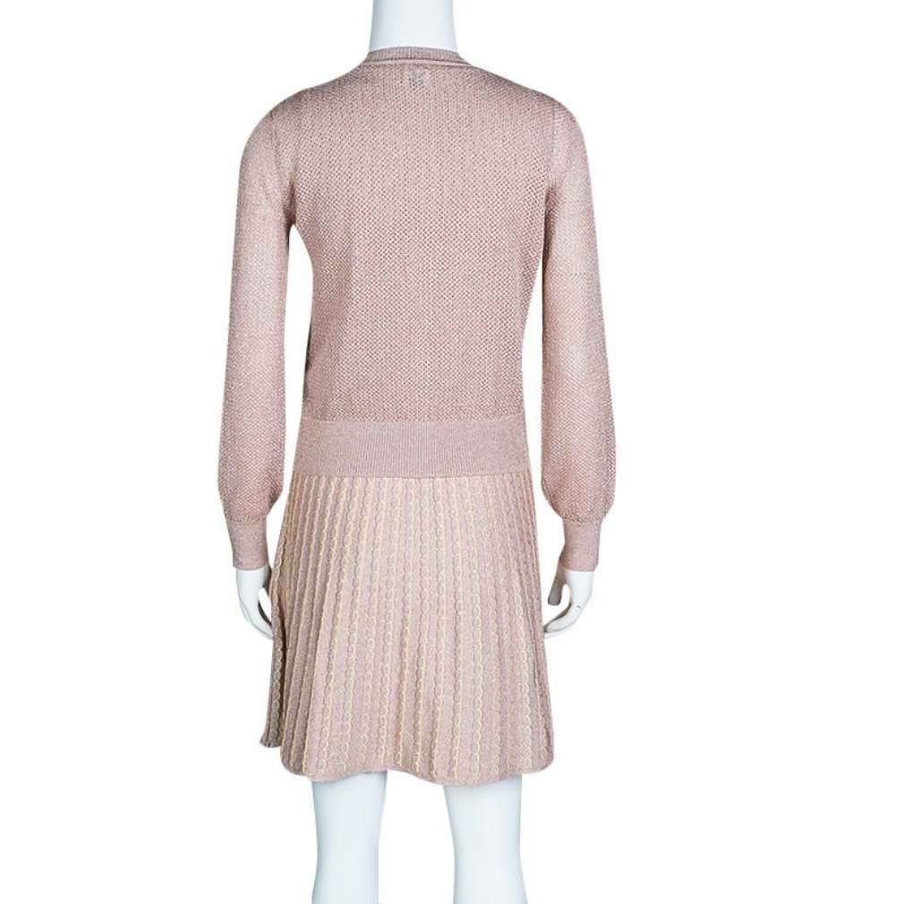 This fabulous set is from M Missoni and it delights in a dress and a matching cardigan. They've been knit from the finest fabrics with the dress designed in a sleeveless style and patterns while the perforated cardigan features long sleeves and full