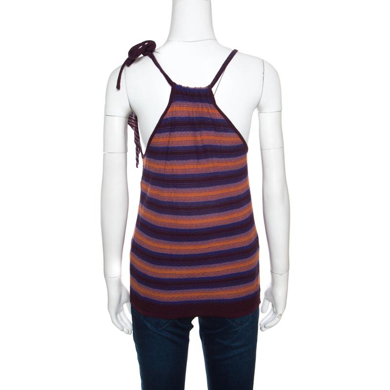 Look every part the fashionista you are in this M Missoni top that was created from quality fabrics. Designed as a sleeveless with stripes, a tie detail and a racer back, this top is versatile and can be worn with skirts and jeans.

Includes:
