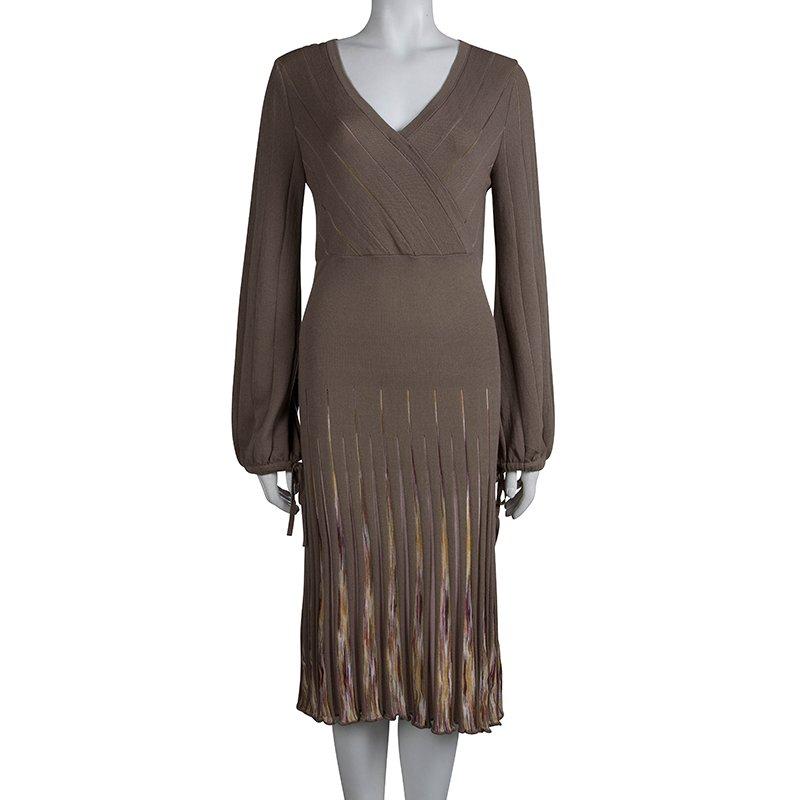 This wool blend sweater dress takes boring winter outfits to the next level. The knee-length dress features V-neck and full sleeves. With a fitted design, the dress comes with drawstrings at the cuffs and a ruffled hemline.

Includes: The Luxury