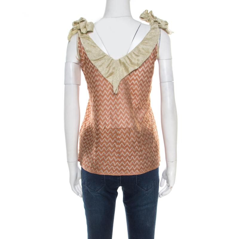This stylish M Missoni top is essential in every fashionista's wardrobe. Tailored from blended fabric, this will keep you comfortable throughout the day. It has chevron patterns and straps with tie details.

Includes: The Luxury Closet