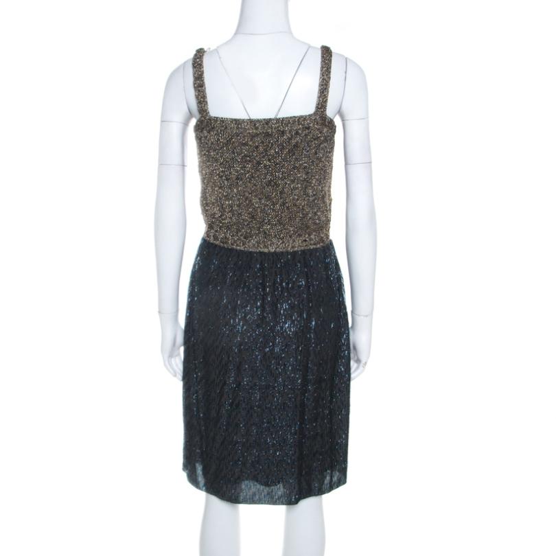 This M Missoni outfit is an utmost symbol of class and sophistication. Tailored from a nylon blend, it features gold crochet detailing. This masterfully designed short dress will dazzle your appearance for a party or an evening out. Team it with