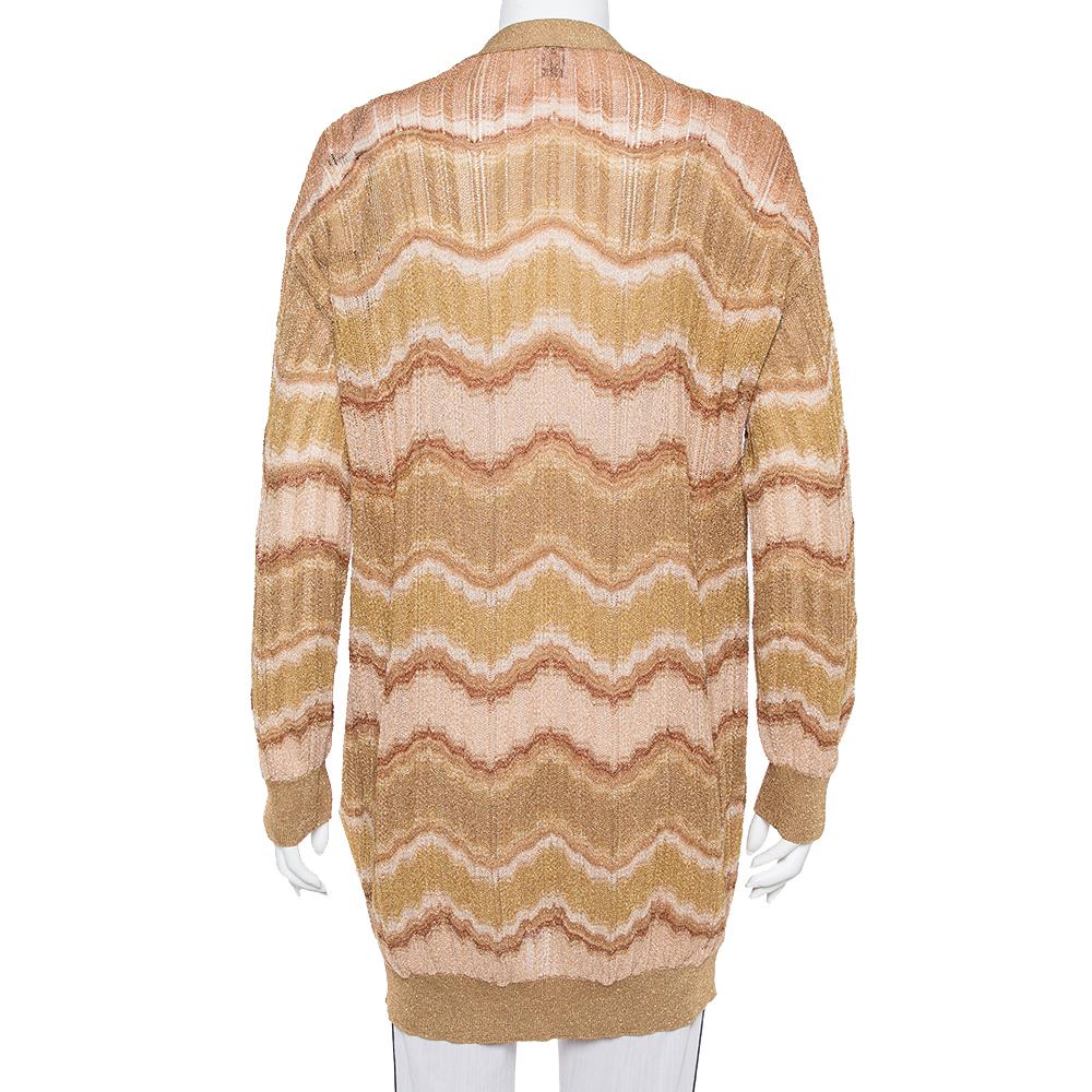 Knit from a blend of the finest materials, this M Missoni cardigan is a keeper. It carries wave patterns all over along with long sleeves and front buttons. Simple yet stylish, this gold cardigan will be a fine wardrobe addition.

Includes:Brand Tag