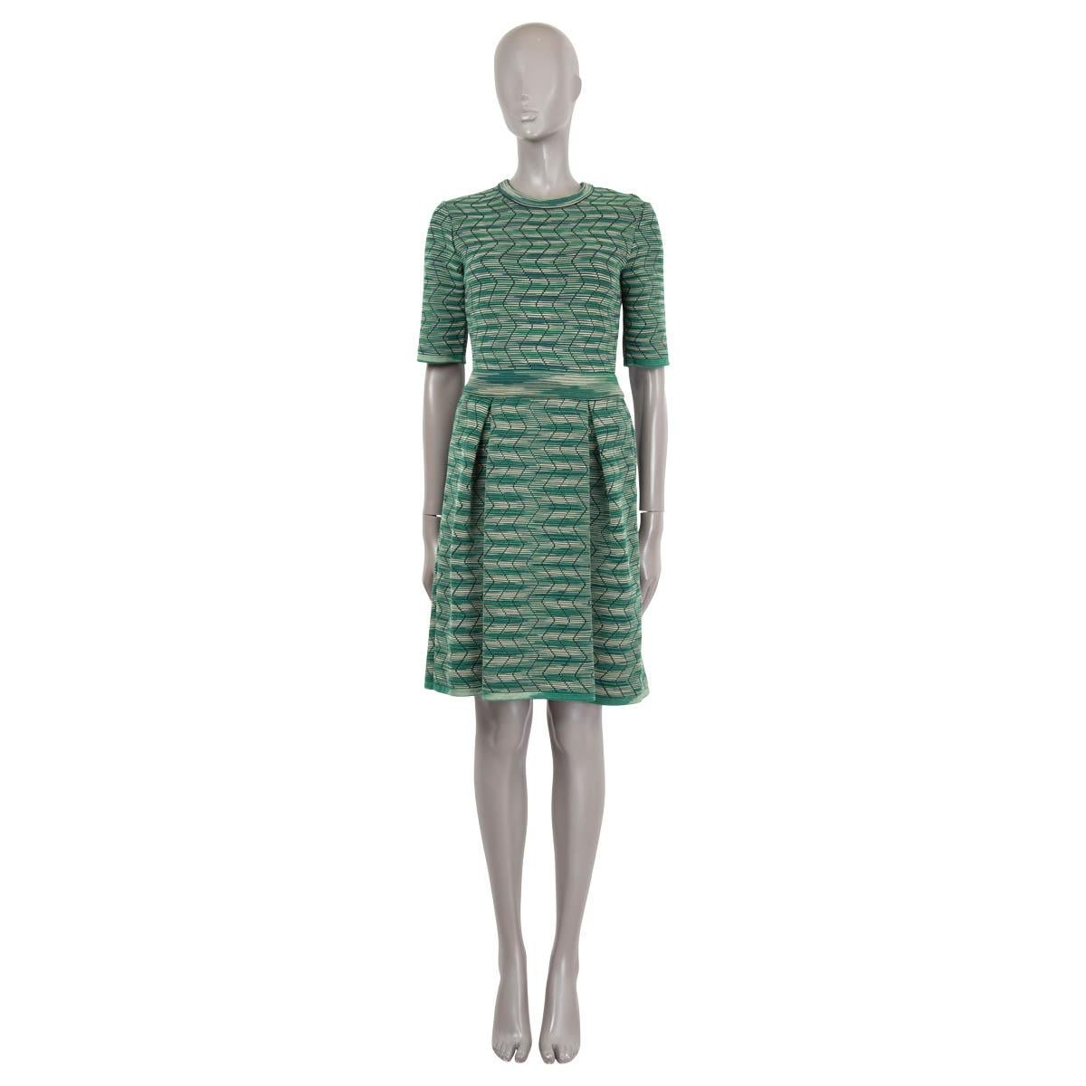 100% authentic M Missoni zig zag jacquard flared dress in green, beige and black striped polyamide (37%), viscose (30%), wool (33%) and viscose (30%). Features short sleeves and box pleats on the skirt. Unlined. Has been worn and is in excellent