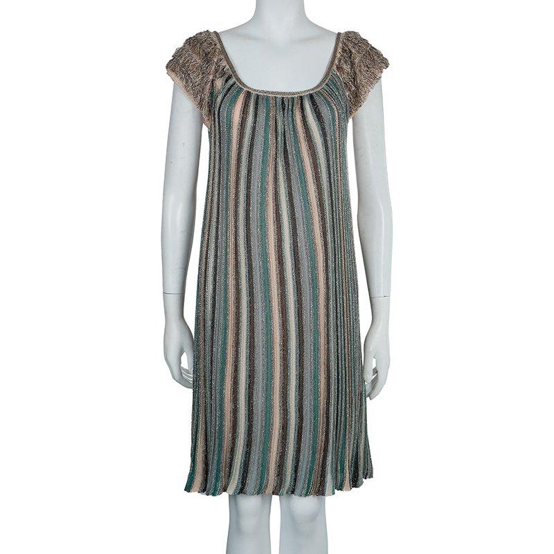 Treasure this adorable and modish Lurex knit dress tailored by M Missoni. It is crafted from viscose, polyethylene and nylon blend, featuring beautiful fringed short sleeves. This dress is accented with a square shaped neckline.

Includes: The