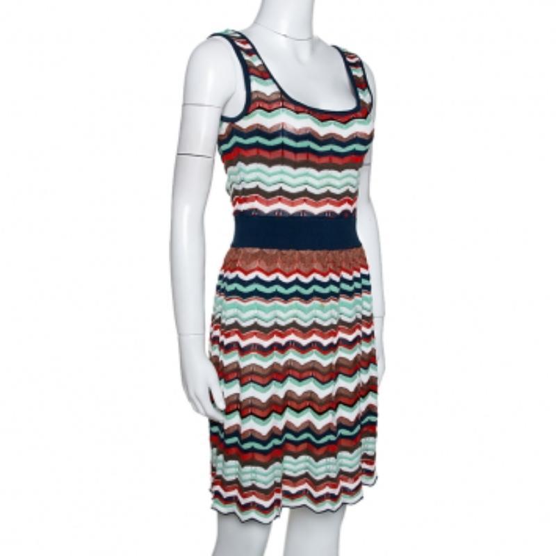 Wear this stylish sleeveless dress by M Missoni and deliver effortless looks when you step out. Crafted from a cotton-blend, it comes in multicolored hues and flaunts an interesting pattern throughout. It has cut out detailing on the back, a wide