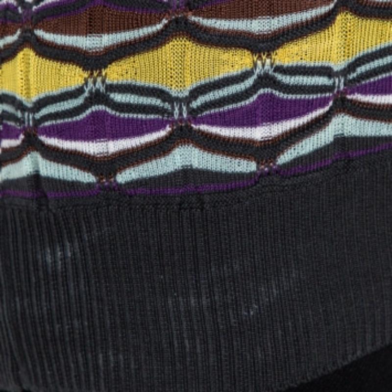 Elegant and modern are two words that pretty much define this M Missoni cardigan and top set. It is a beautiful creation made from a cotton blend in multicolored hues. The sleeveless tank top is cut to the perfect shape and has contrasting trims.