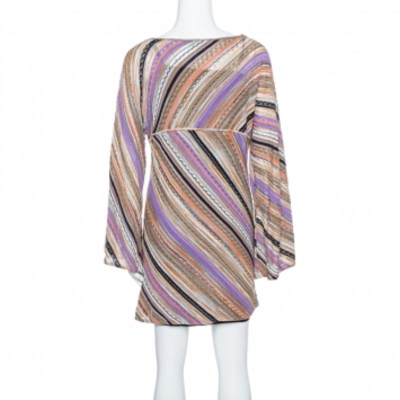 Celebrate the arrival of spring in great style with this M Missoni dress. Featuring a perforated knit body, this dress comes with multicolor chevron pattern and a wide neckline. It comes with flared sleeves that make it a bang-on-trend piece. We