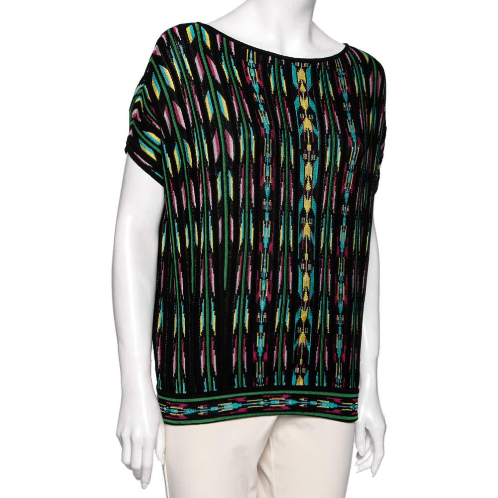 Elevate your fashion game with this lovely M Missoni top. Stitched from a fine blend of fabrics it has a perforated patterned design and comes with short sleeves. The multicolored top will go perfectly with a pair of jeans.